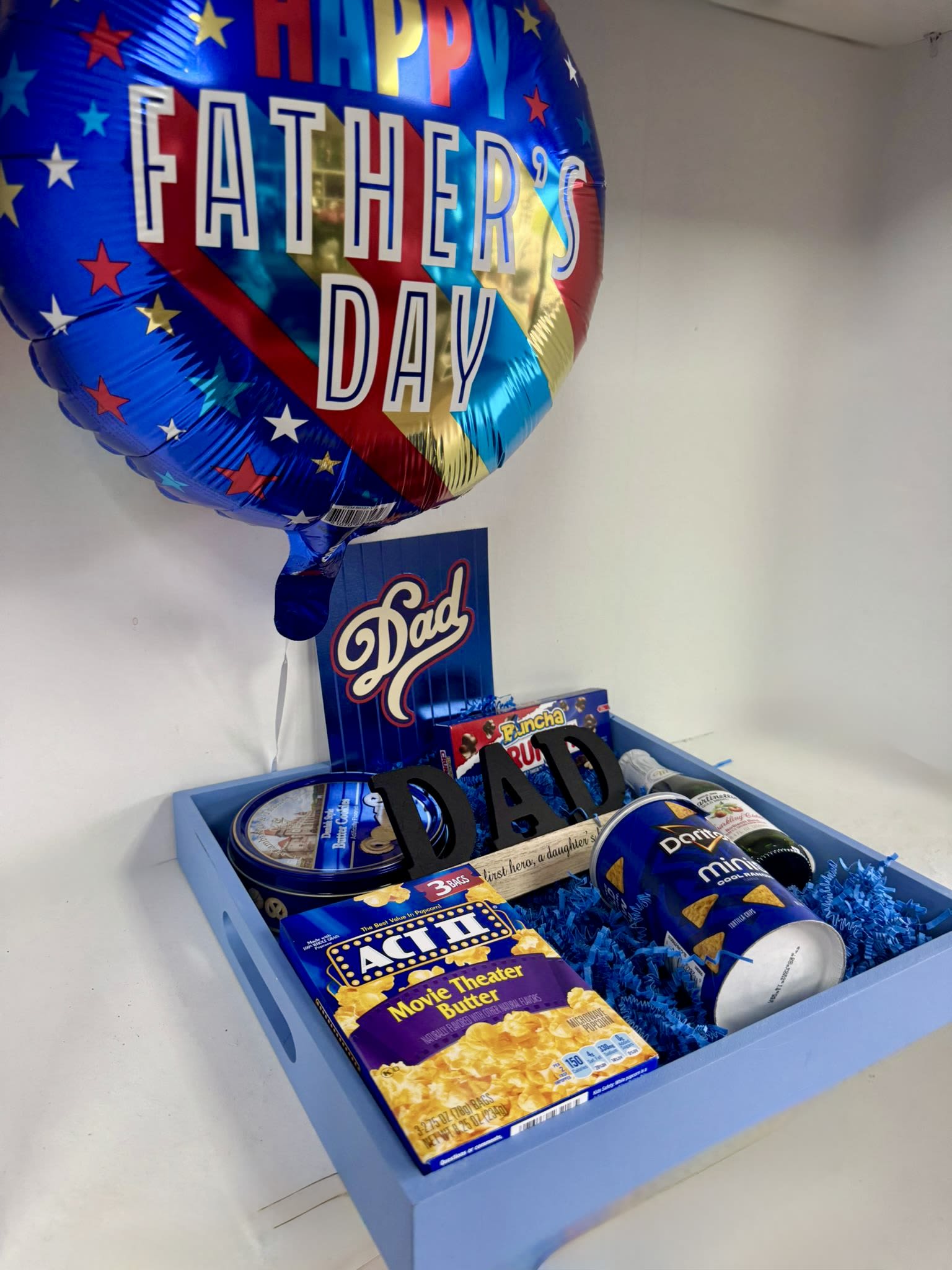 Special Tray  - A blue wooden tray includes a balloon and assorted items similar to the photo. 