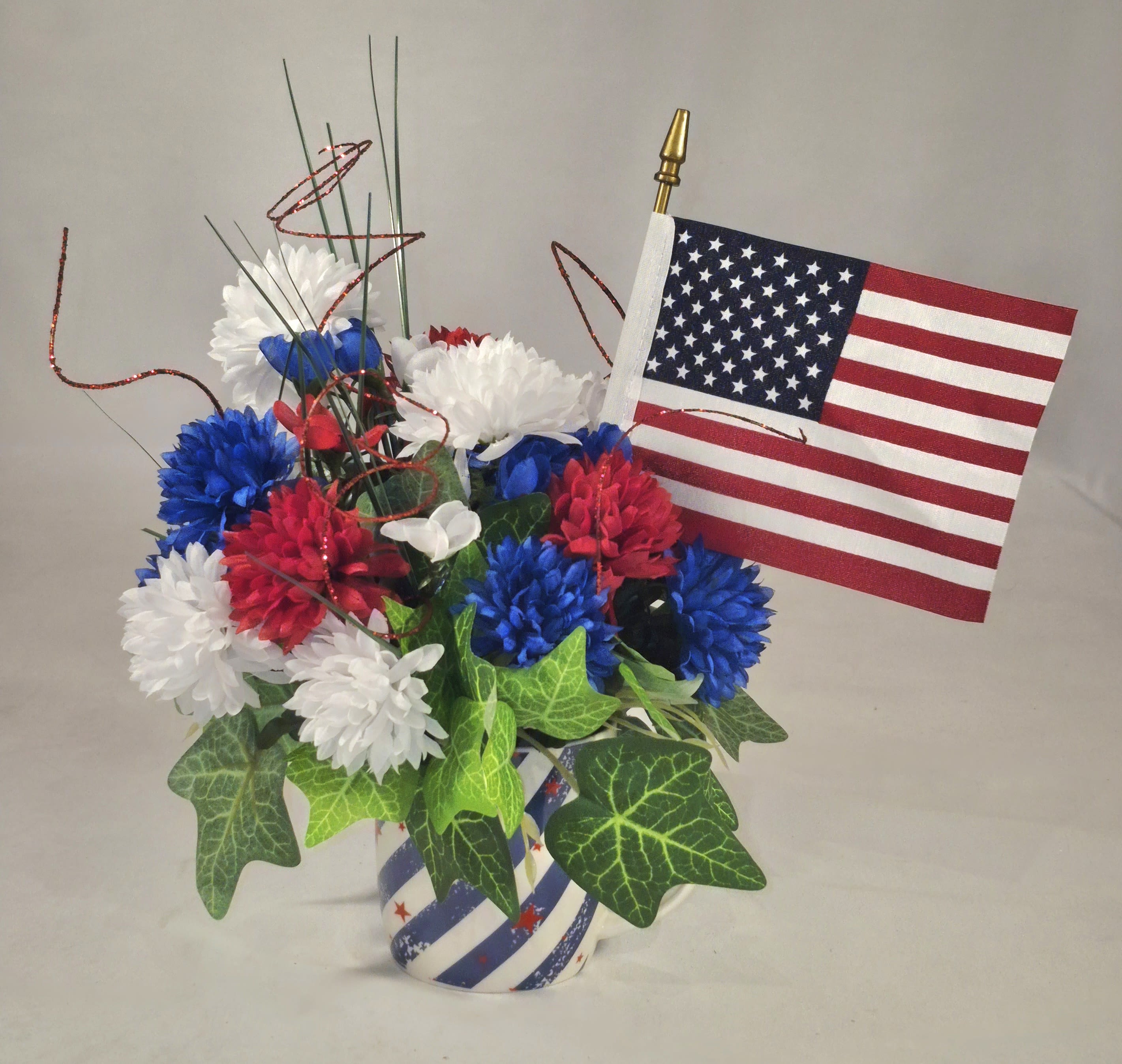 Stars &amp; Stripes Silk Flag Arrangement - Sparkly festive 4th of July silk patriotic centerpiece with American Flag.  11' Tall 7&quot; Wide 