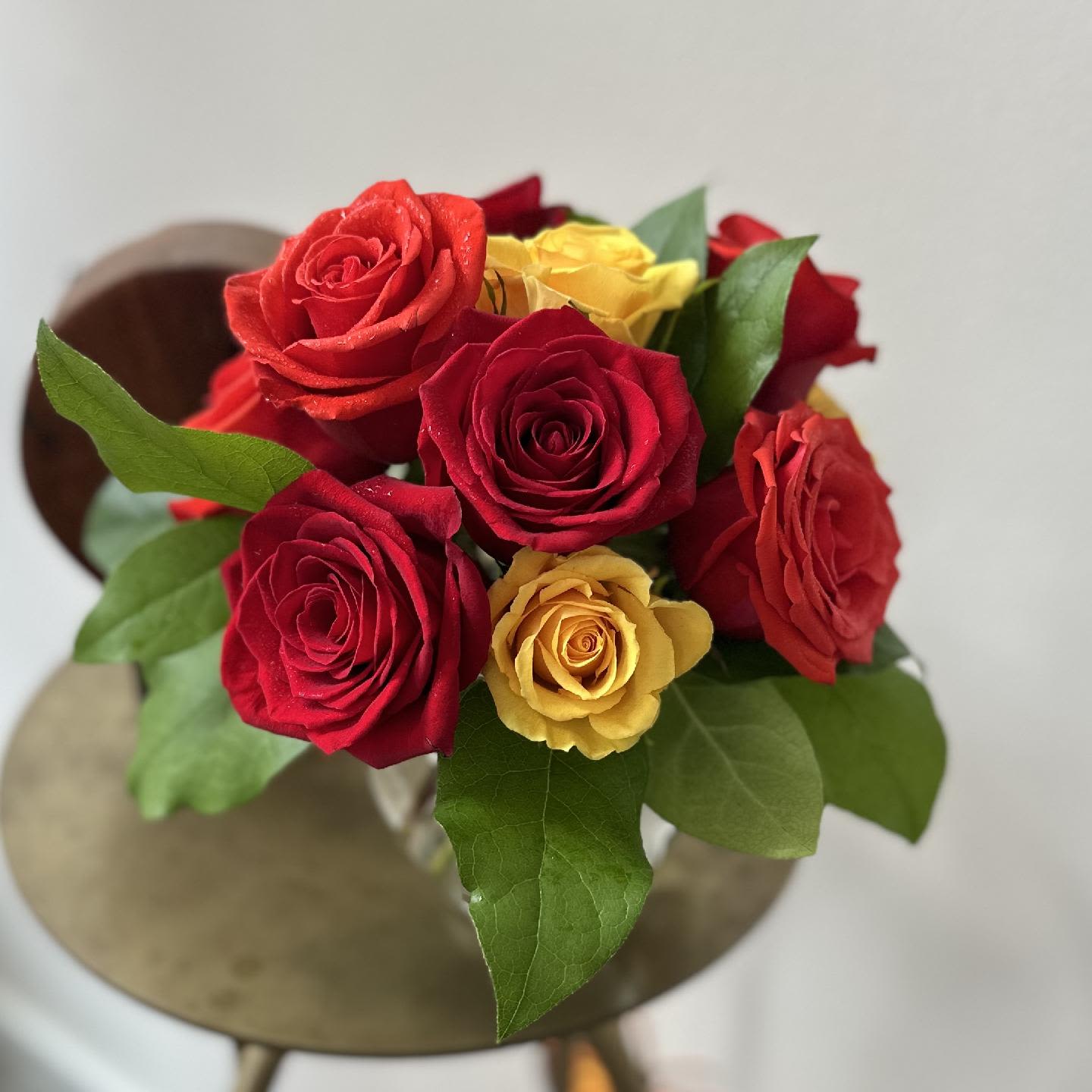 Falling Leaves Falling Leaves - One dozen richly autumn colored roses, gathered in a fluted ivy bowl with premium greens. An elegantly tasteful design.