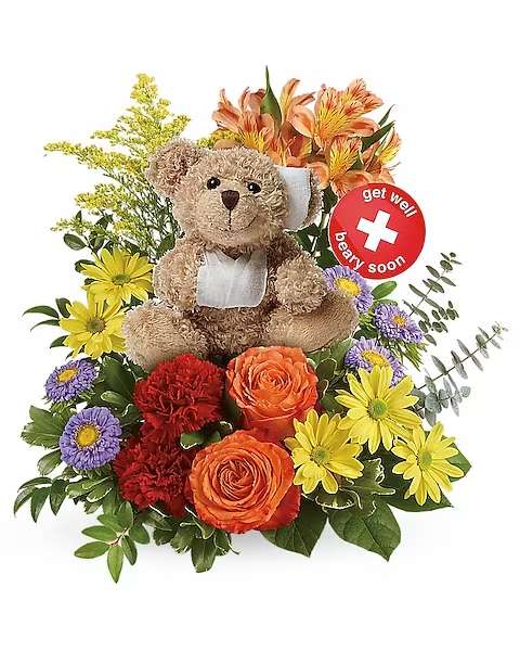 Get Better Bouquet by Teleflora - They're sure to get well &quot;beary&quot; soon with this hand-delivered, thoughtful surprise of fresh mixed flowers and sweet snuggles from this charming bear plush bouquet!  This cheerful arrangement includes orange roses, orange alstroemeria, red carnations, lavender aster matsumotos and yellow daisy spray chrysanthemums, accented with yellow solidago, variegated pittosporum, spiral eucalyptus, huckleberry and lemon leaf. Delivered with a Beary Well Bear plush keepsake.