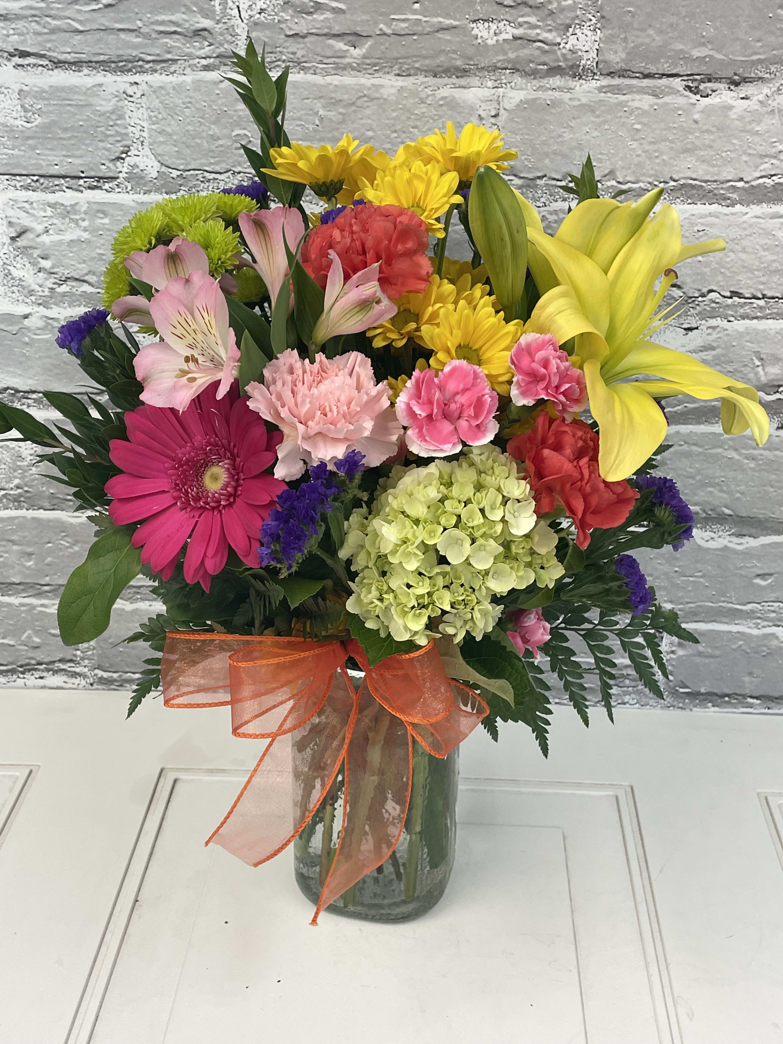Festive Mason Jar - *These arrangements will not be identical to this picture. We will be designing colorful bouquets with these types of flowers...just might not be the same exact colors...but will be bright with yellows, greens, pinks, oranges, etc. in a mason jar type vase!