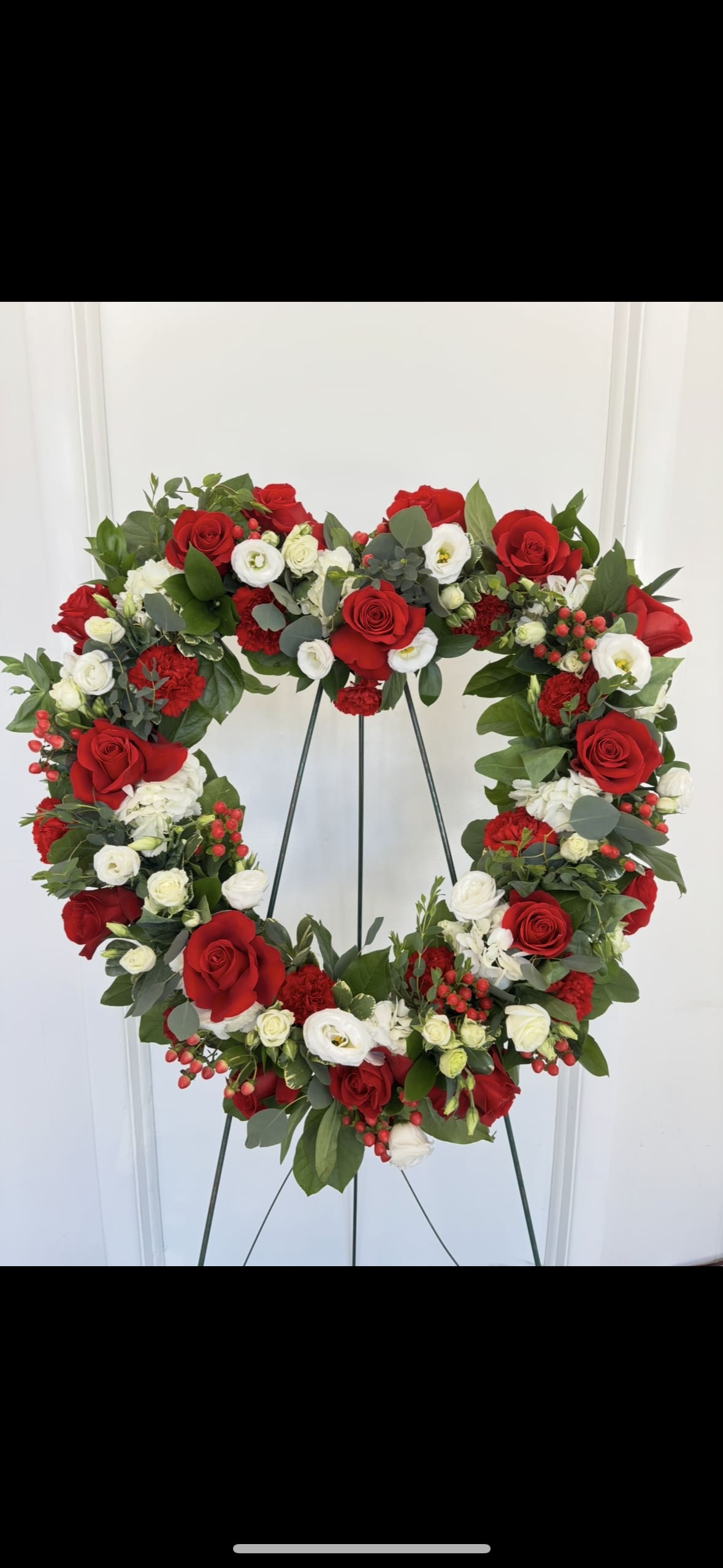 Red and White Open Heart  - Large open heart with red roses, red berries, red carnations, white lisianthus, white hydrangeas, white spray roses. Finished with eucalyptus. 
