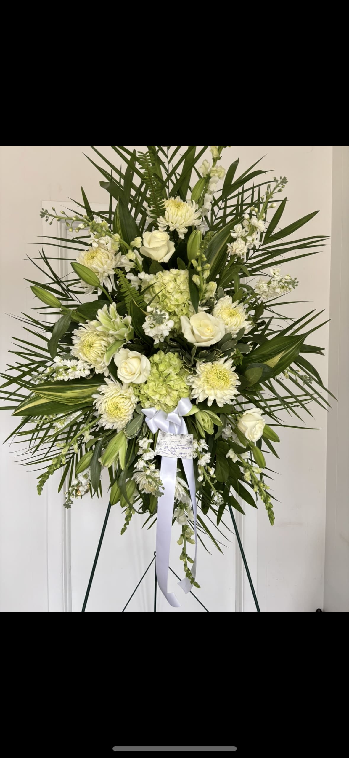 Standing Spray Light Green and White  - Standing spray with lime green hydrangea, white snap dragon, white roses, white Lillie’s. Finished with premium greens. 