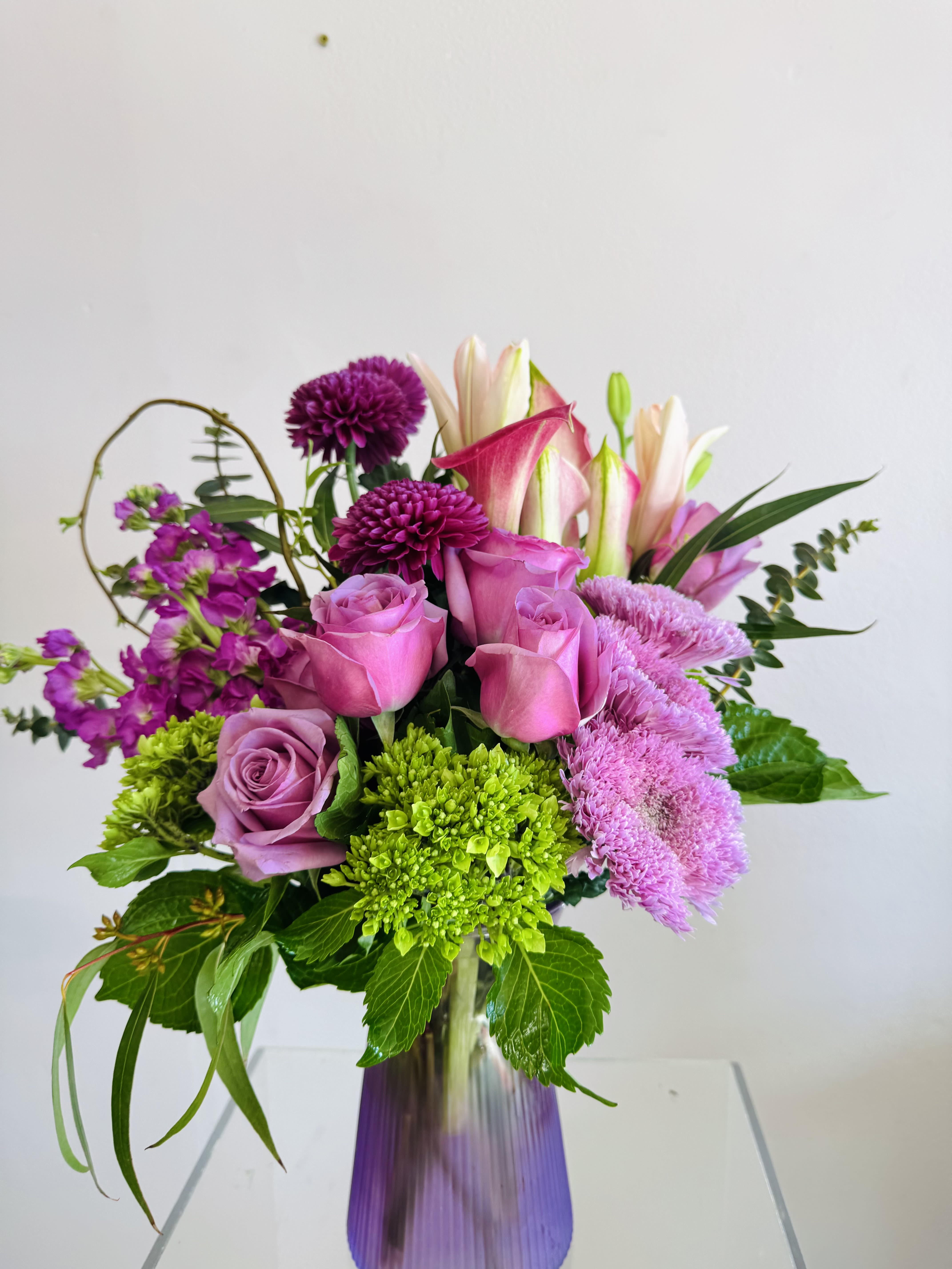 Purple Paradise  - A mixed variety of purple florals with an accent of greenery. 