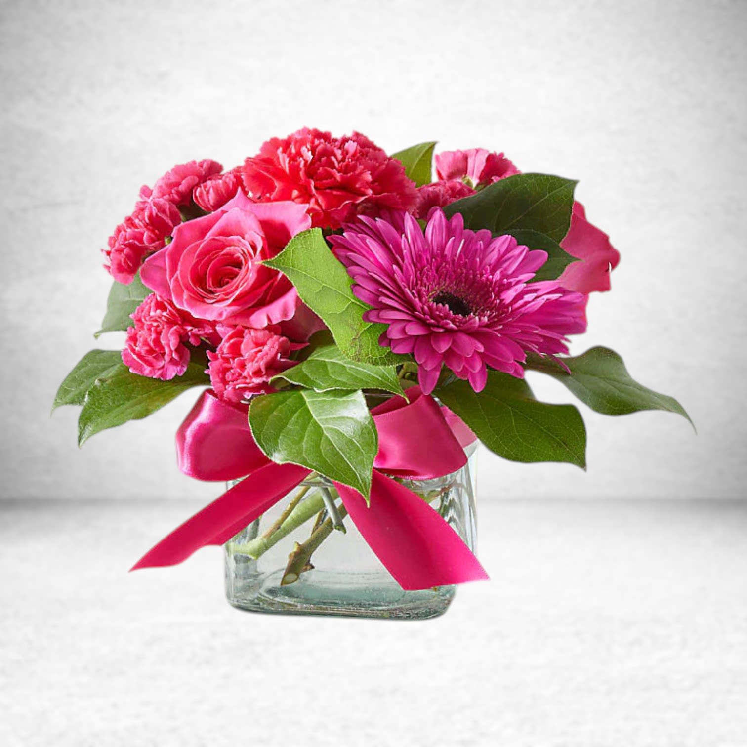 Everyday Love Bouquet - EVERYDAY LOVE BOUQUET Any day is a great day to show someone how much you love them with this bright pink arrangement.  Please Note: The bouquet pictured reflects our original design for this product. While we always try to follow the color palette, we may replace stems to deliver the freshest bouquet possible, and we may sometimes need to use a different vase.