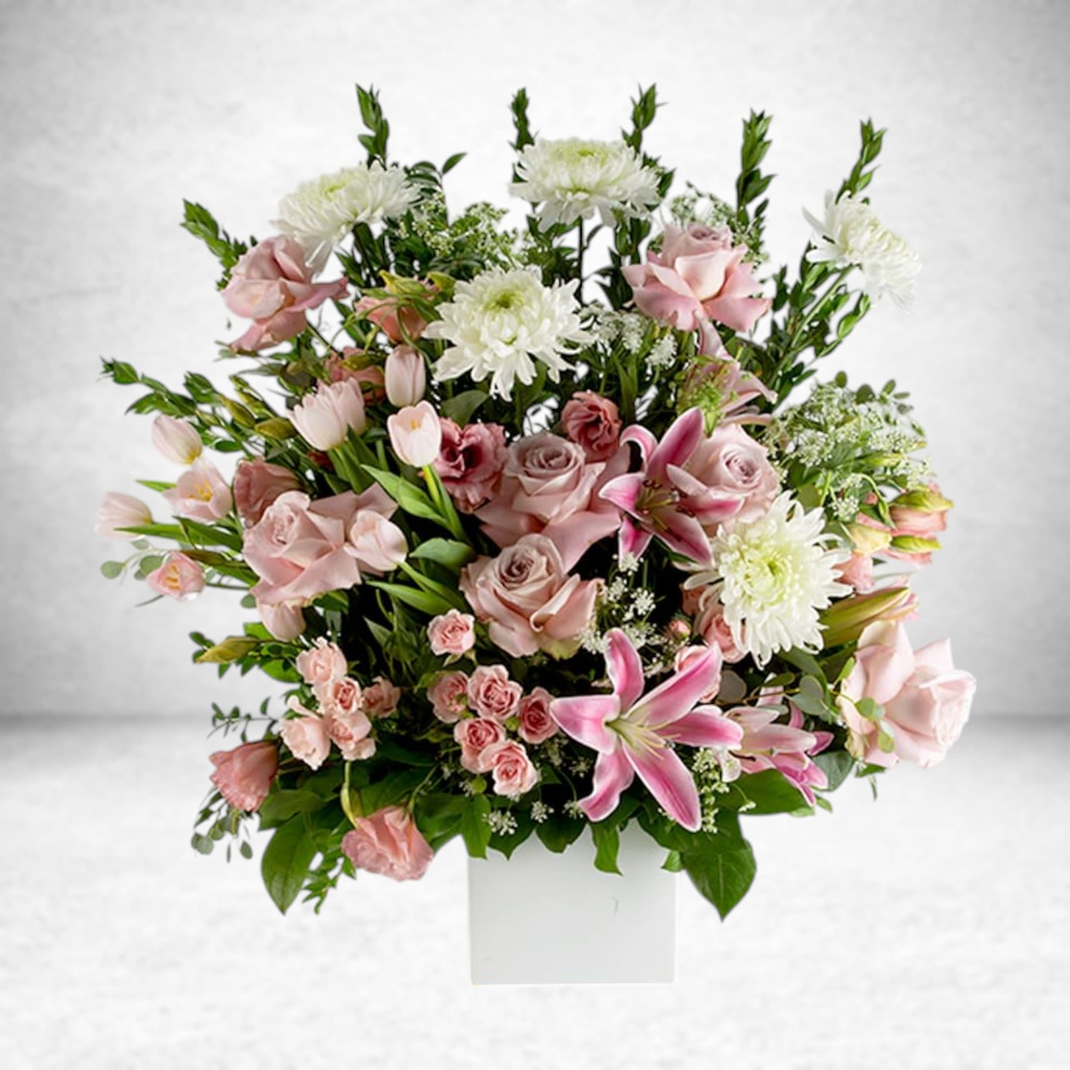 Harmony  - This pink and white funeral basket is a lovely sendoff and tribute. Fitting for any type of ceremony. 