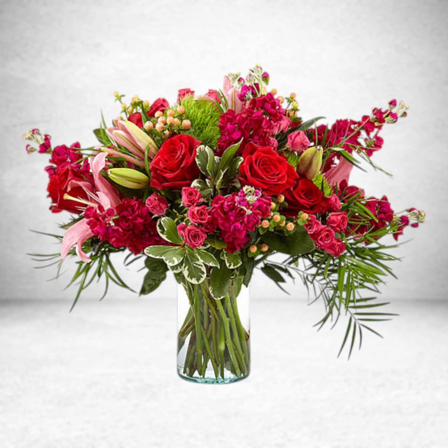 Truly Stunning Bouquet Truly Stunning Bouquet - The Truly Stunning Bouquet instantly complements any room with luscious blooms and bold colors. Featuring truly elegant blooms like red roses pink Asiatic lilies green trick dianthus and more set in a clear glass cylinder vase this collection of flowers livens up wherever its placed with beauty. Substitution Policy In some instances, our photo may represent an overall theme or look and include a one-of-a-kind vase which cannot be exactly replicated. Although the actual bouquet may not precisely match the photo, its temperament will. Occasionally, substitutions of flowers and/or containers happen due to weather, seasonality and market conditions which may affect availability. If this is the case with the gift you’ve selected, we will ensure that the style, theme and color scheme of your arrangement is preserved and will only substitute items of equal value or higher value.