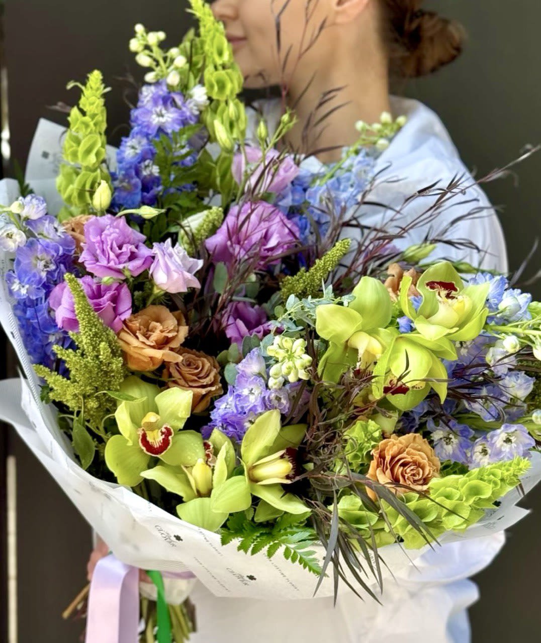 Spring Freshness  - A bright bouquet with noble orchids, complemented by delicate blue and lilac flowers, will cheer up and delight with its fresh and juicy appearance.
