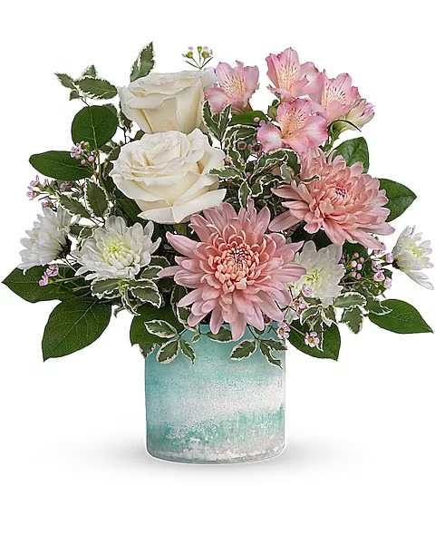 Teleflora's Sweetly You Bouquet - Send your sweetest wishes their way with this charming bouquet of cream and pink blooms, presented in a beautiful art glass vase that's sure to be a décor favorite.  Creme roses, pink alstroemeria, pink disbud chrysanthemums, white cushion spray chrysanthemums and pink waxflower are arranged with lemon leaf and pitta negra. Delivered in a Color Frost Art Glass cylinder.