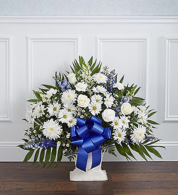 HEARTFELT TRIBUTE™ FLOOR BASKET- BLUE & WHITE HEARTFELT TRIBUTE™ FLOOR BASKET- BLUE & WHITE - Offer a peace and tranquility that comes from classic blue and white flowers. Our elegant floor basket arrangement, handcrafted by our caring florists with rich blue delphinium and crisp white blooms, is a tasteful gesture perfectly suited for the funeral home or memorial services.