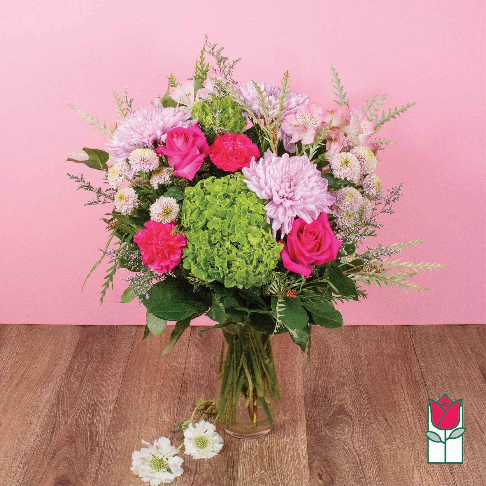 Beretania's Charming Bouquet (Seasonal Varieties Vary) - The Beretania Florist Charming bouquet is a stunning floral arrangement that features a captivating blend of seasonal mixed garden flowers in bold, vivid hues. This bouquet is expertly arranged in a chic glass vase and includes premium blooms such as lavender cremone, pink roses, hydrangea, alstroemeria, and other exquisite flowers that perfectly complement each other. The result is a breathtaking display of beauty and elegance that is sure to impress. This popular item is available for delivery throughout the Honolulu area, making it easy to surprise someone special or brighten up your own space. With its timeless appeal and sophisticated charm, the Beretania Florist Amethyst bouquet is the perfect way to express your feelings and show your appreciation. Order yours today and experience the joy of fresh, beautiful flowers from Beretania Florist.