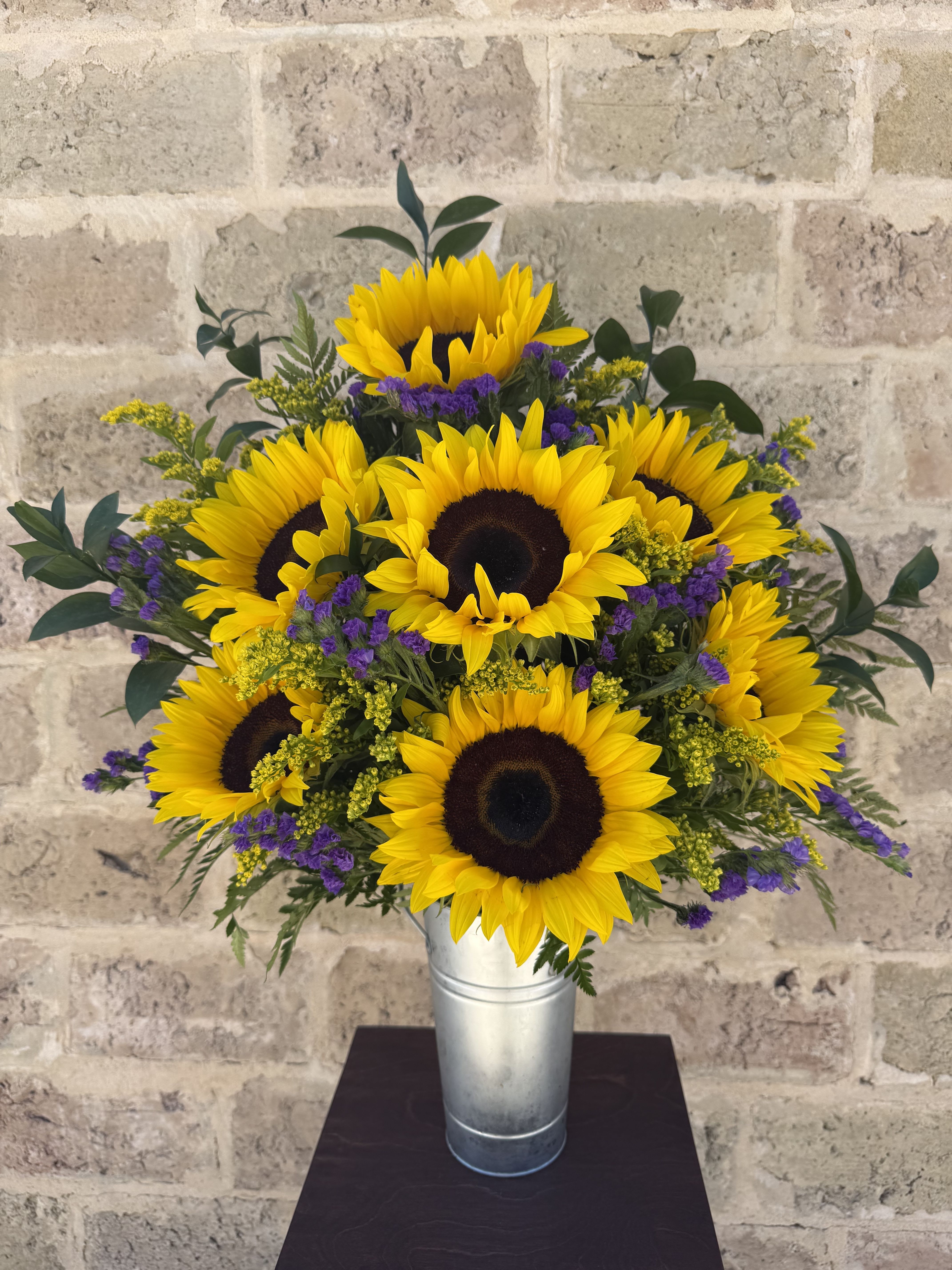 Snazzy Sunflowers - Nothing lights up a room like the golden glow of sunny sunflowers, gathered up and presented in a big bouquet. Send this generous bunch to a special friend, and you’ll be sure to receive a cheerful thank you in return!