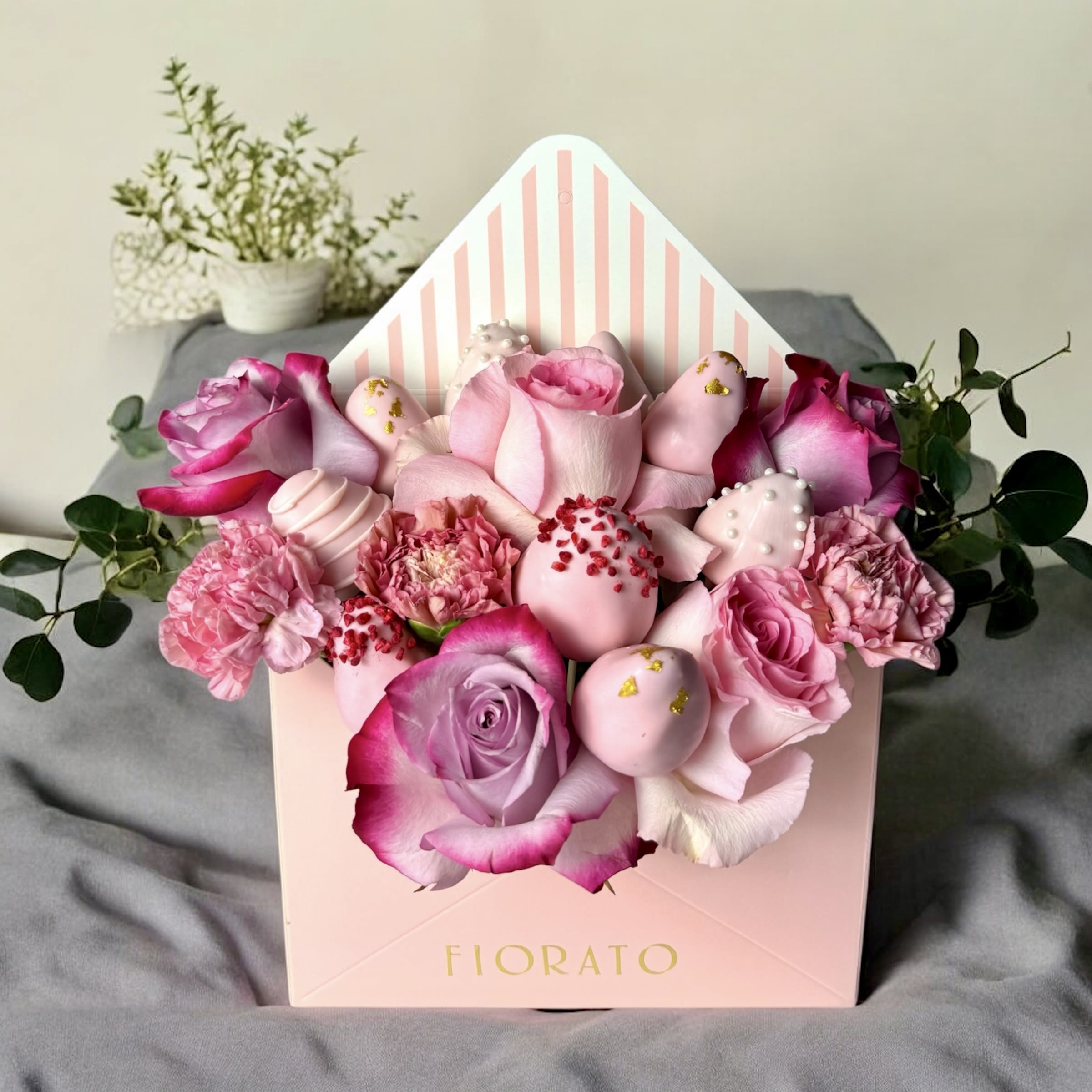 Rosé Melody - Rosé Melody is a symphony of tenderness and elegance. This delicate arrangement combines pink and lavender roses with exquisite chocolate-covered strawberries, beautifully presented in an envelope-style box. Perfect for gifting love, sweetness, and charm in an unforgettable surprise. 