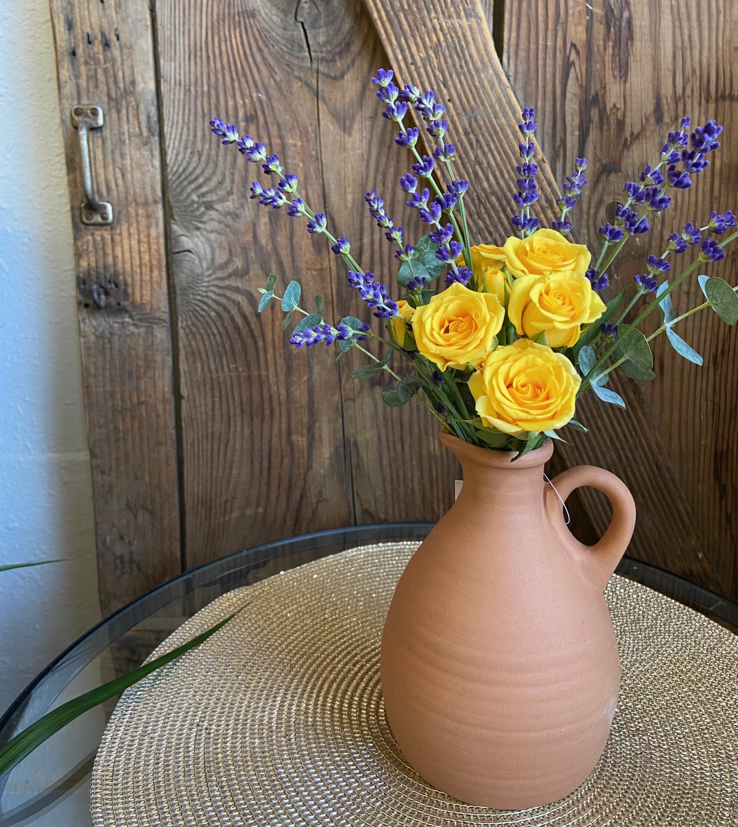 Lavender Sunlight - Keepsake Terra Cotta vase with simple arrangement of fresh Lavender and Spray roses. The delicate fragrance is sure to please. Limited time available.