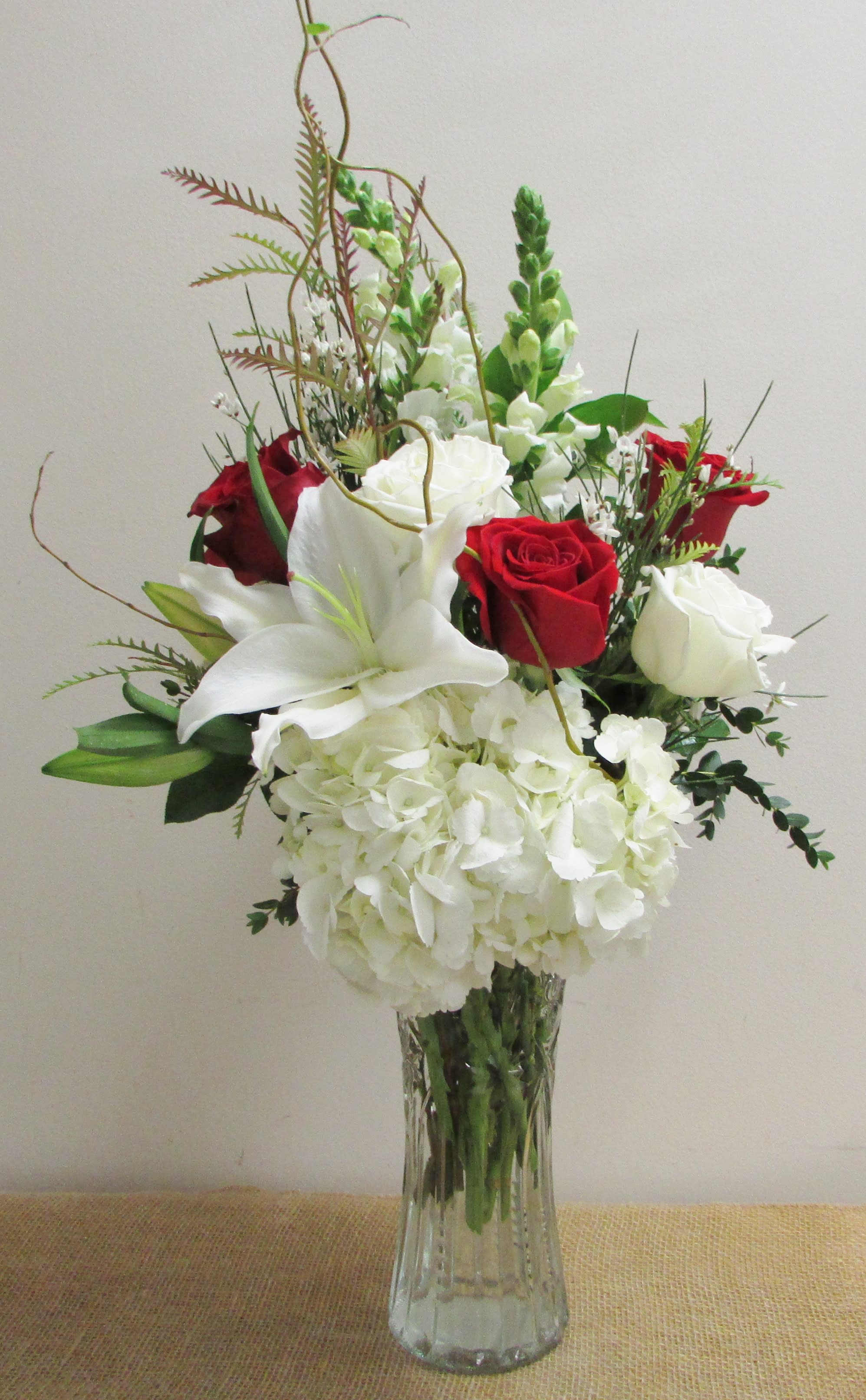 Romantic Romantic - A romantic arrangement in classic red and white. The perfect gift for a loved one in a tall glass vase