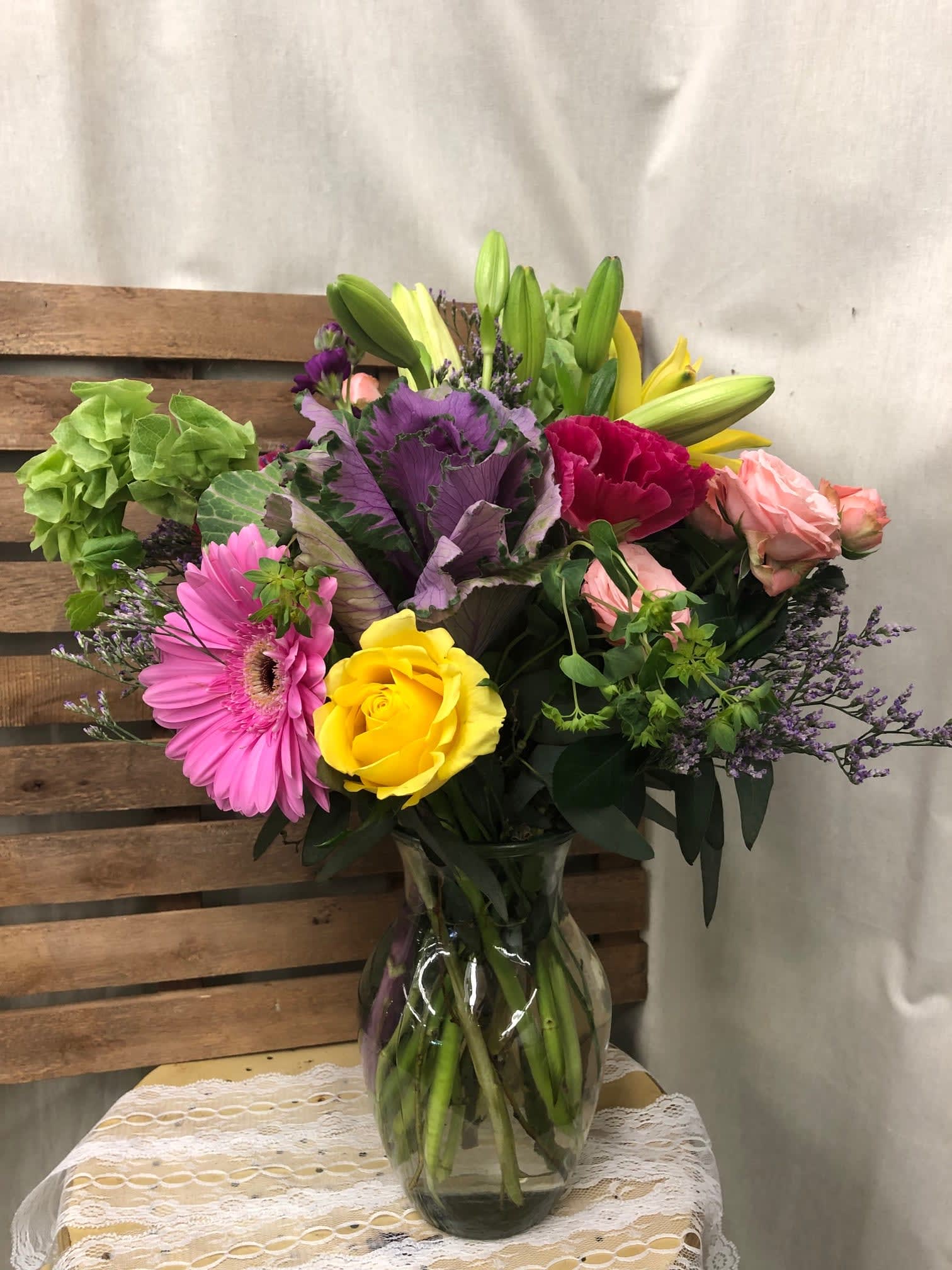 Summer fun!  - This bright colored flower arrangement says Summer is Here!! Bright yellow roses, Pink Gerber Daisys, Bells of Ireland, Lilies &amp; seasonal Godetia make a bright &amp; cheery arrangement fit for any occasion. 