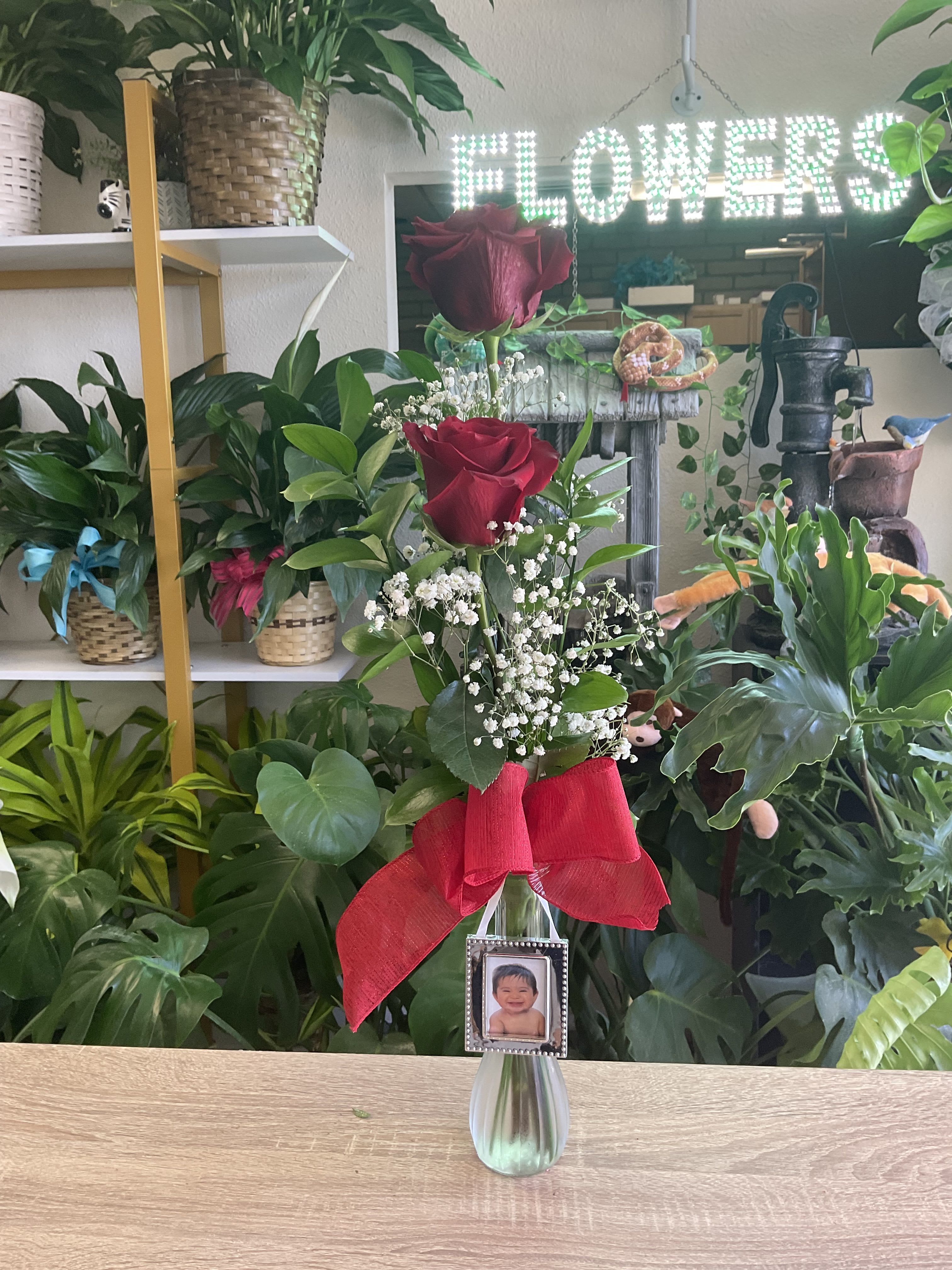 Two Rose Bud Vase with personalized photo Two Rose Bud Vase with personalized photo - Two red roses in bud vase , with small picture frame Email picture of your choice to Espinozaflowers1@gmail.com once you place your order