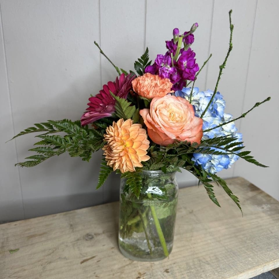 Sunny Day Surprise - Brighten up your day and the days of your loved ones with our &quot;Sunny Day Surprise&quot; arrangement! Our talented floral designers are ready to create a one-of-a-kind masterpiece bursting with vibrant, colorful flowers that will instantly lift spirits and add a ray of sunshine to any occasion.