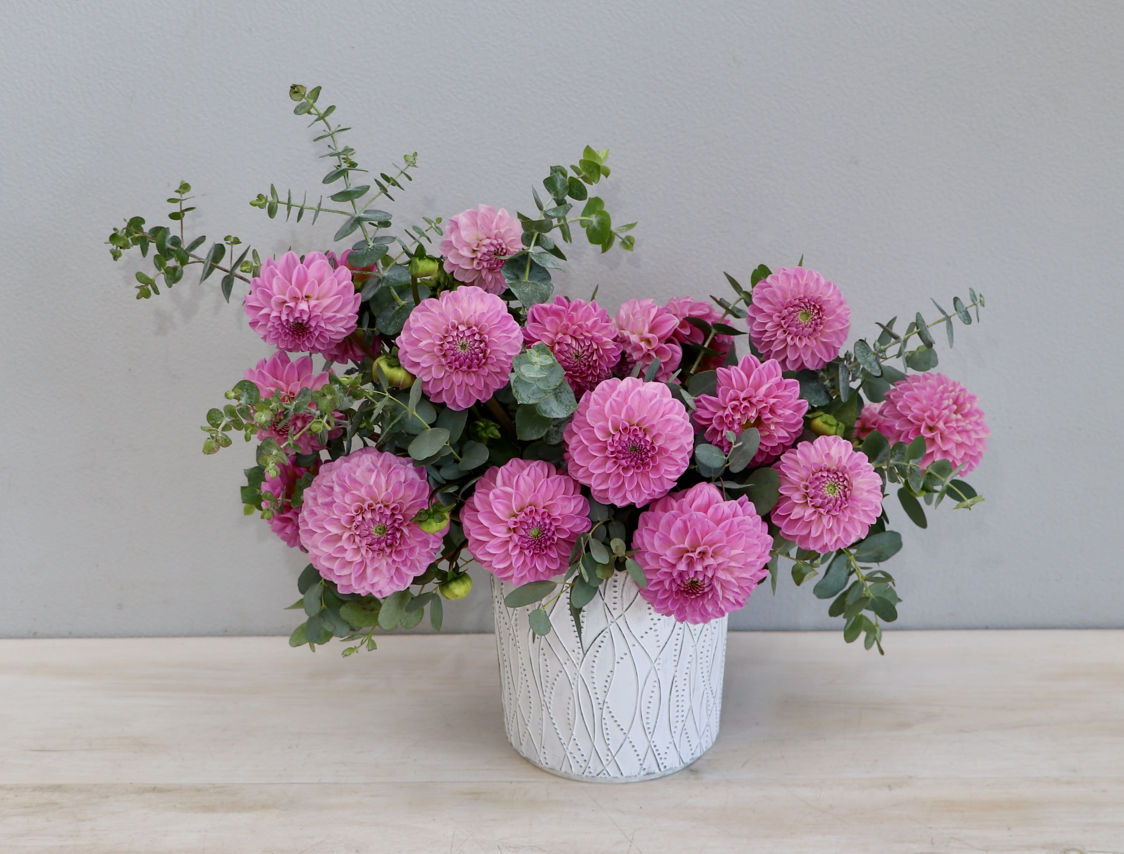 Dahlia Dreams - My Glendale Florist Dahlia Dreams - My Glendale Florist - Dahlias are officially back in season! A dreamy arrangement with hot pink dahlias and fluffy eucalyptus for a romantic and ethereal feel. The photo shown is in the standard size, holds about 20 dahlias.