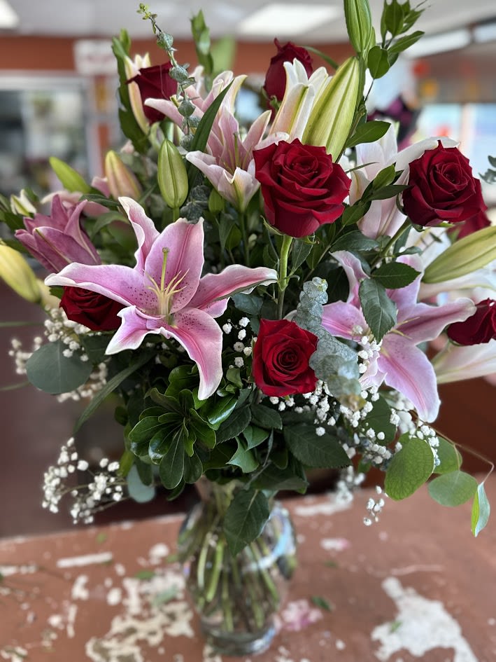 Stars 'n Roses Stars 'n Roses - Full of roses, stargazer lilies and baby's breath. This full bodied arrangement is perfect for any occasion.