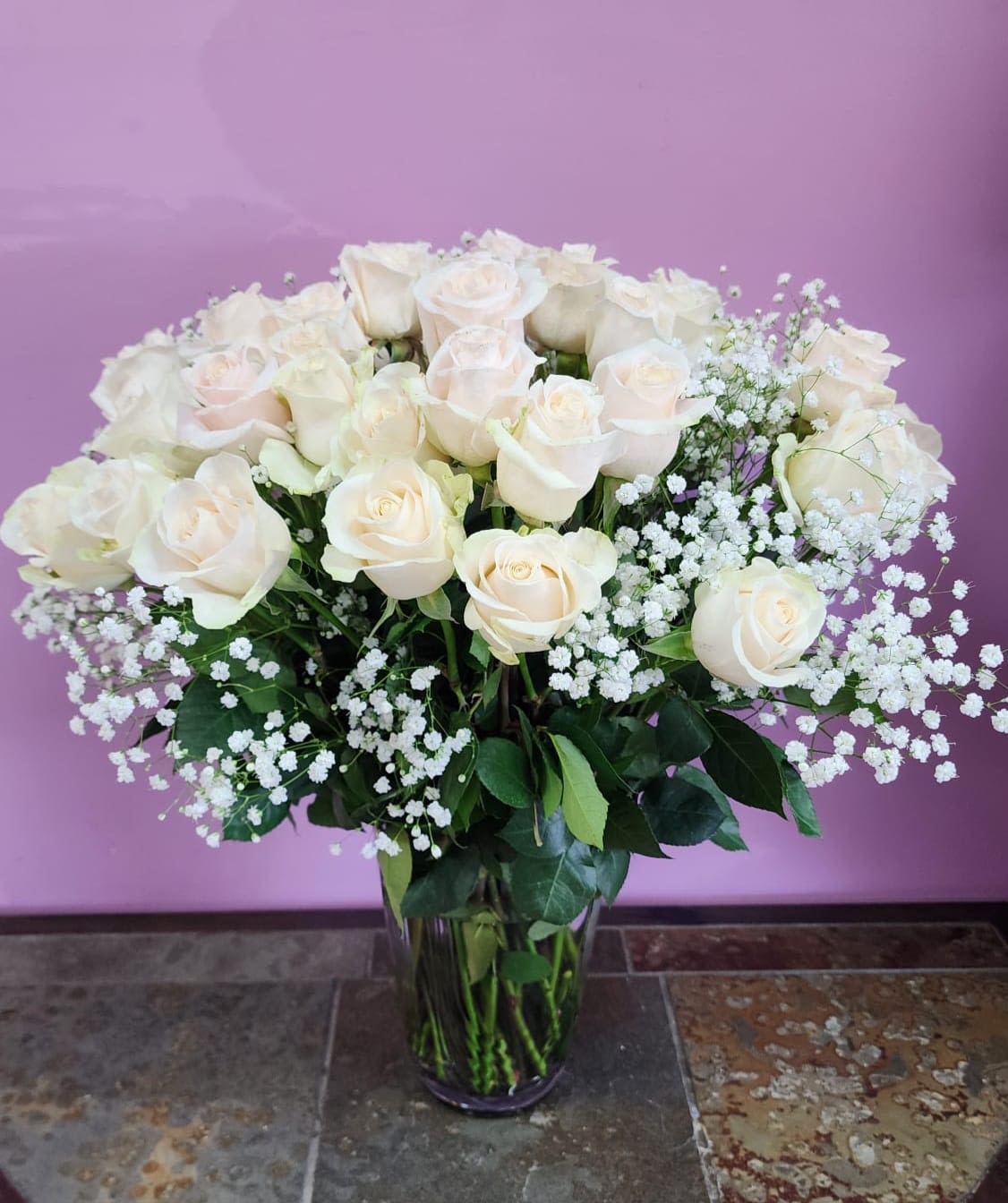 Moonlight - Long stem white roses. 4 dozen white roses, with baby breath and greenery. 