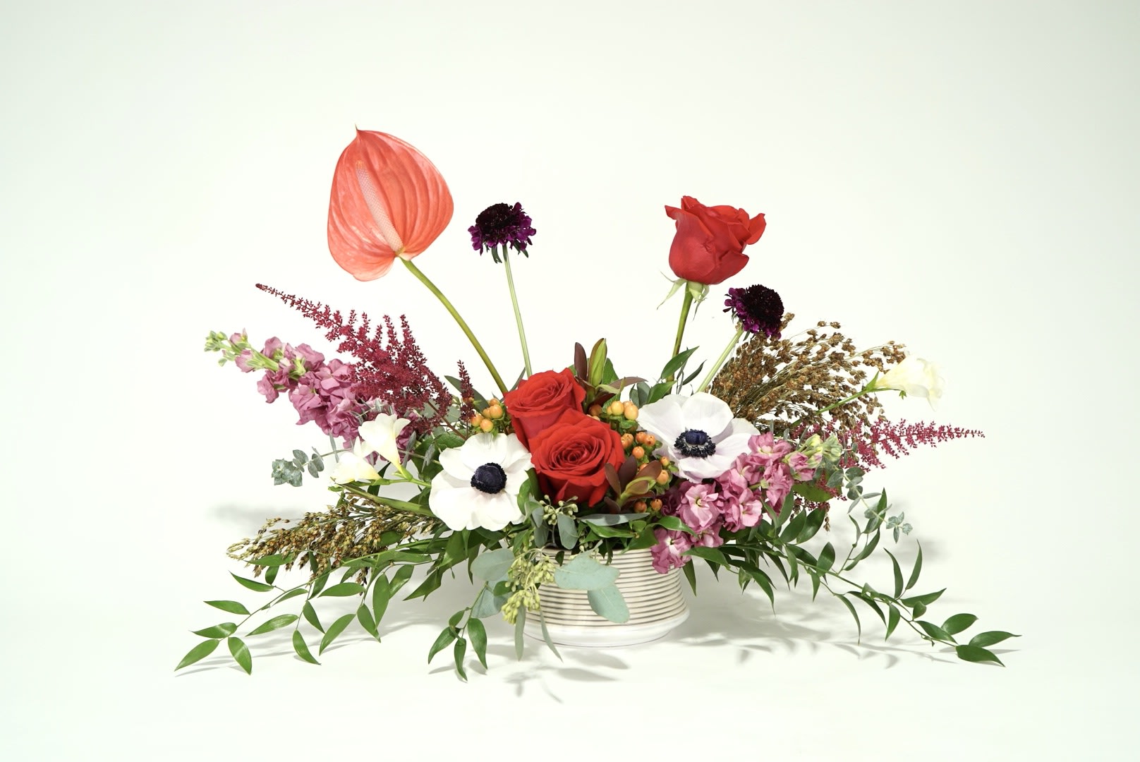 Fall into Romance  - Love doesn't have to be reserved. This long and low arrangement features colors and flowers that are a festive way to send love during the Autumn season. 