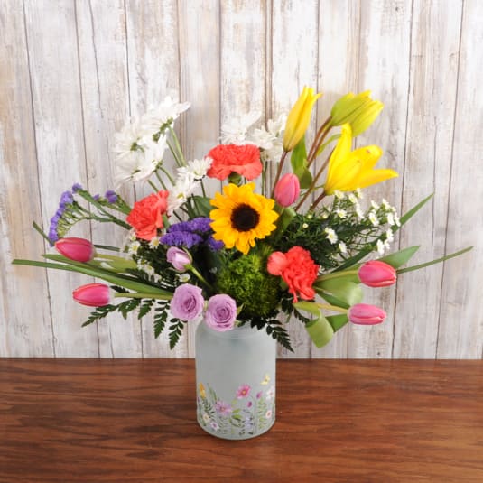 Wildflower - A unique floral vase filled with bright blooms.  Shades of orange, pink, yellow, purple and white accents.  