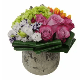 Flintstone Love Flintstone Love - (16) Exceptional choice of flowers in luminous dual tone varieties skillfully arranged in a WHITE OR SILVER vase. Substitutions may be necessary due to availability.