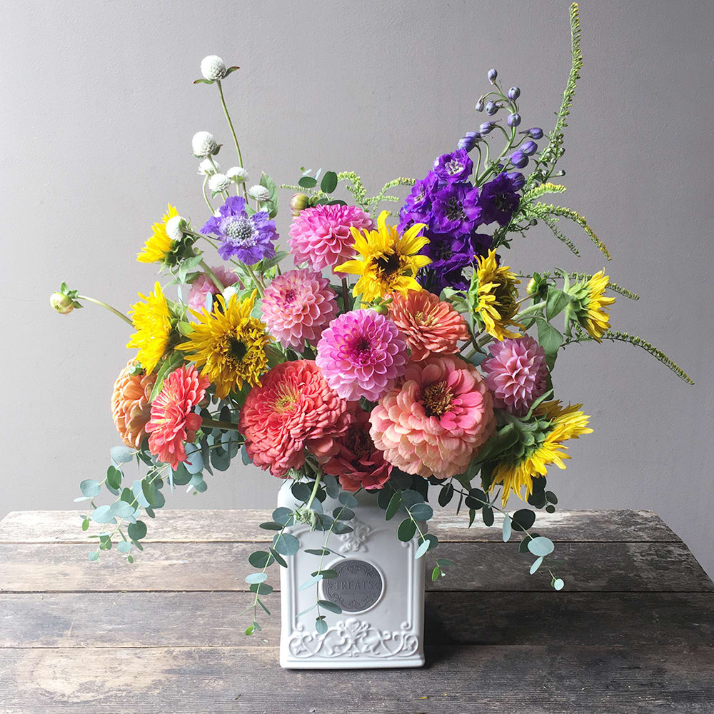 Malverk (Gallery Photo) - Bright and colorful blooms of dahlias and other seasonal flowers are lovingly gathered to delight that someone on a special day or just because! (Vase may vary.)
