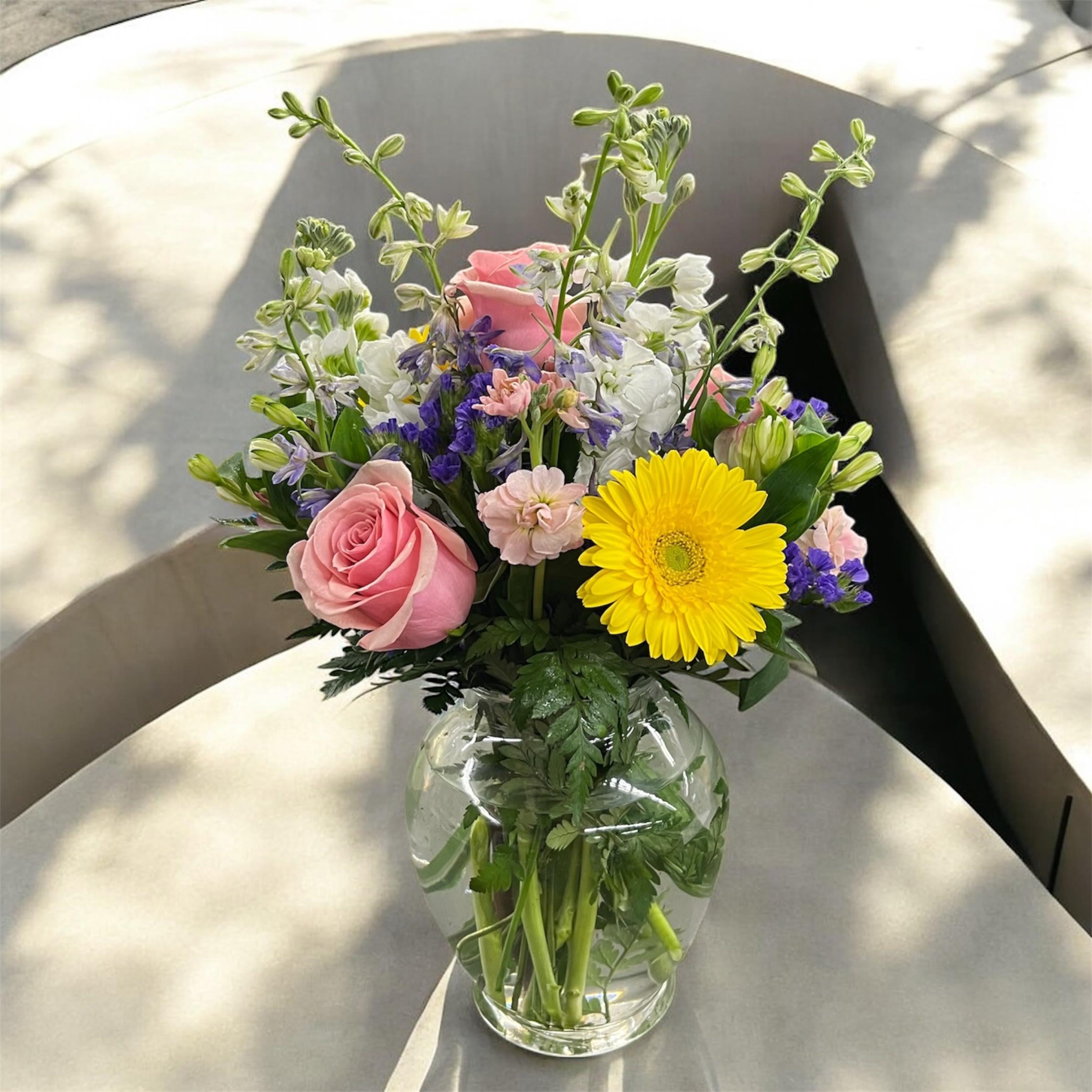 Designer's Choice Congratulations Arrangement - If you’re looking for an exclusive item that is not available anywhere else, choose the Designer’s Choice Vase Arrangement. It’s made freshly by our expert florists. For designer’s choice flower arrangements, we offer you the best and the most affordable price. When placing your order, you should mention the occasion/purpose or any particular preference that you have, so that the designer can keep that in mind while creating the customized arrangement for you. While shopping for festive or occasion-based flowers such as Christmas, Valentine’s Day, Fall flowers, Mother’s Day, Halloween, New Baby, or something else, mention it while placing your order. Our florists will create an arrangement that will be suitable for the occasion. 