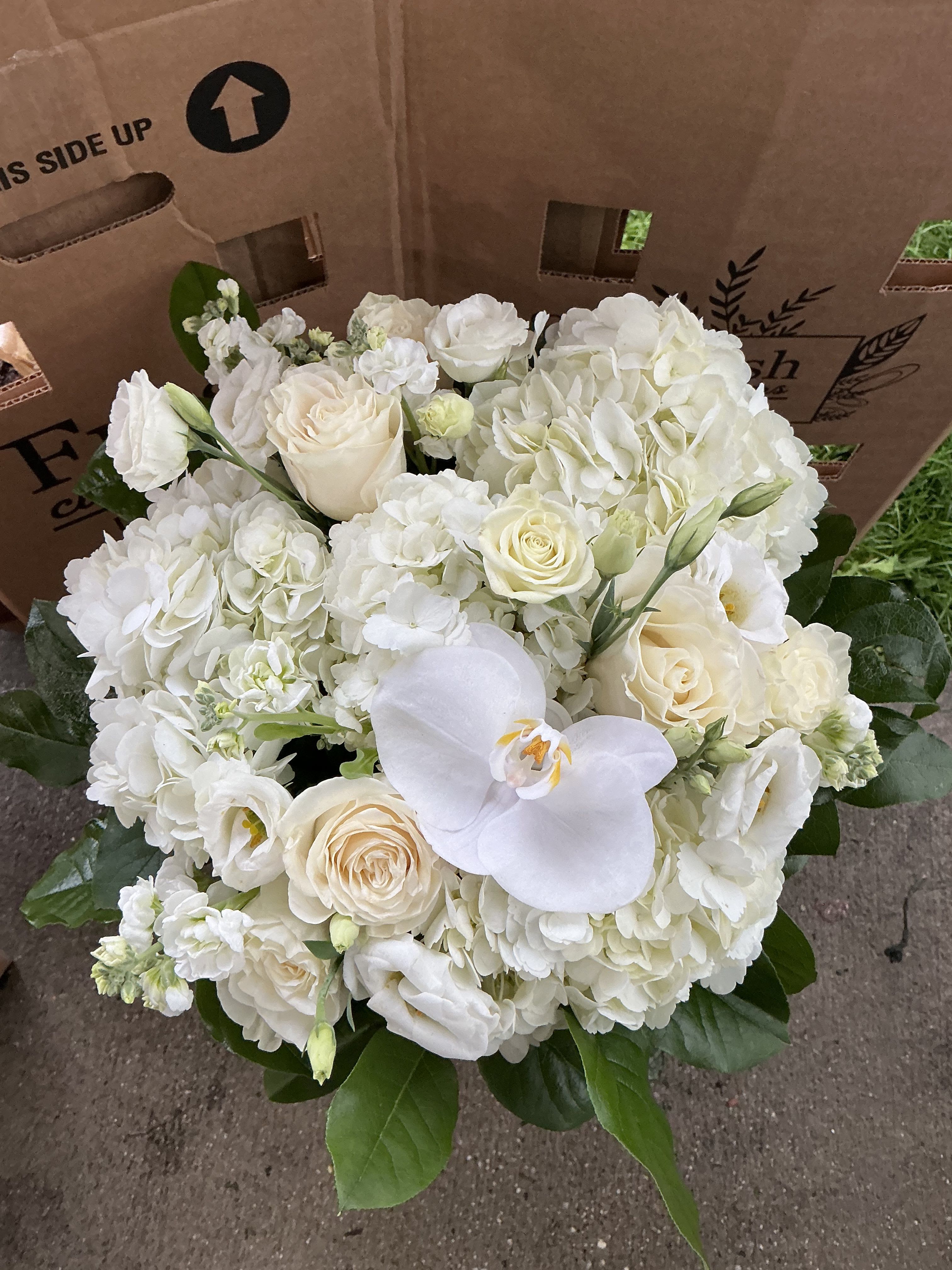 Respect  - This arrangement was made to give strength and respect to the family members in their time of lost     white hydrageas,white orchid,roses,greens and more 11T 11W