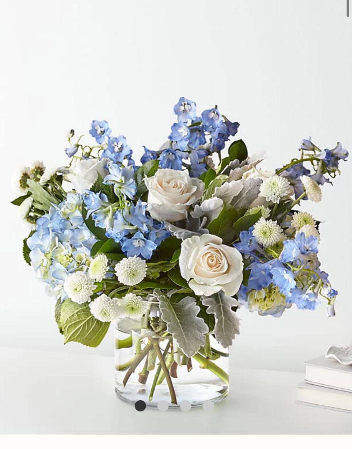 Cloudy Skies -  soft light blue and white flowers that created a lovely centerpiece, appropriate for a table dinner or any special occasion