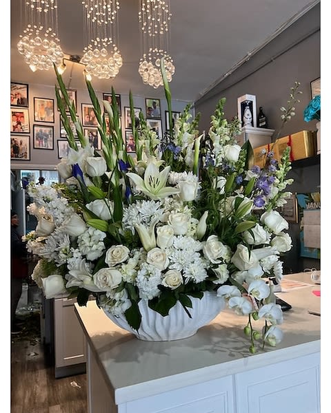 Athens in full bloom - This amazing arrangement is hand crafted with the most beautiful white flowers such as hydrangeas, roses, lilies, gladiolus, spray roses, snapdragons,larkspur and cala lilies  Perfect for sympathy, engagement or any special occasion 