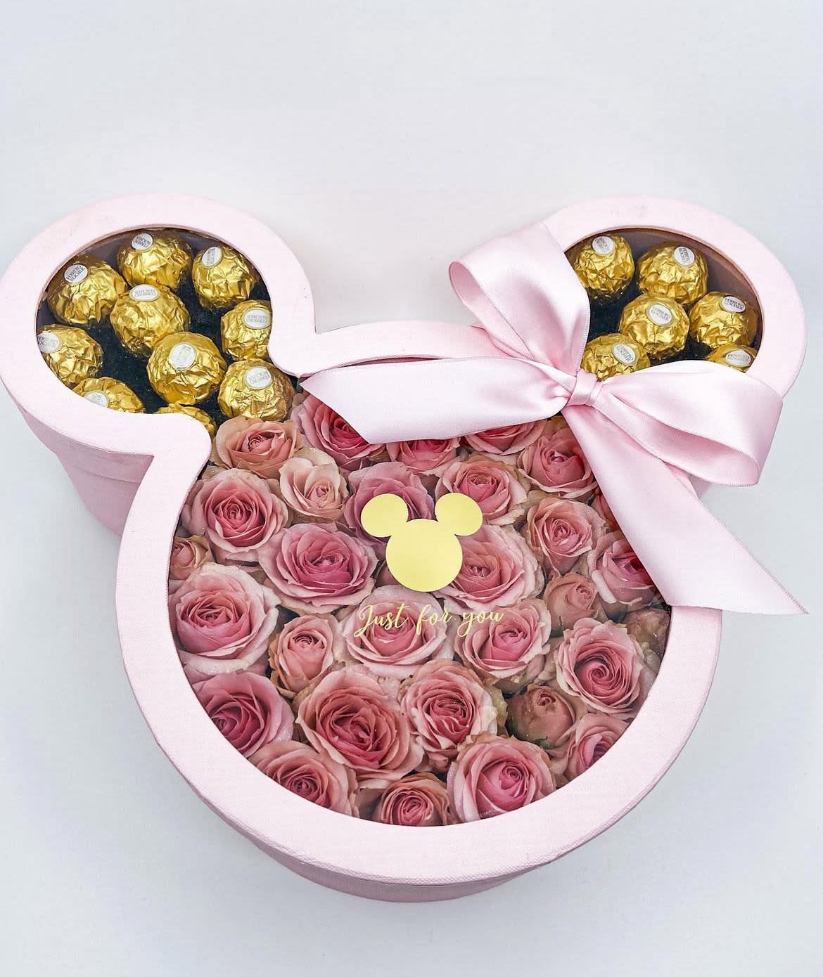 Minnie Mouse Box - In some instances, our photo may represent an overall theme or look and include a one-of-a-kind vase which cannot be exactly replicated.  Although the actual bouquet may not precisely match the photo, its temperament will. Occasionally, substitutions of flowers and/or containers happen due to weather, seasonality and market conditions which may affect availability. If this is the case with the gift you’ve selected, we will ensure that the style, theme and color scheme of your arrangement is preserved and will only substitute items of equal value or higher value.  If any design elements are of major importance to your order, please include them in the florist instructions at checkout or contact us to ensure availability.