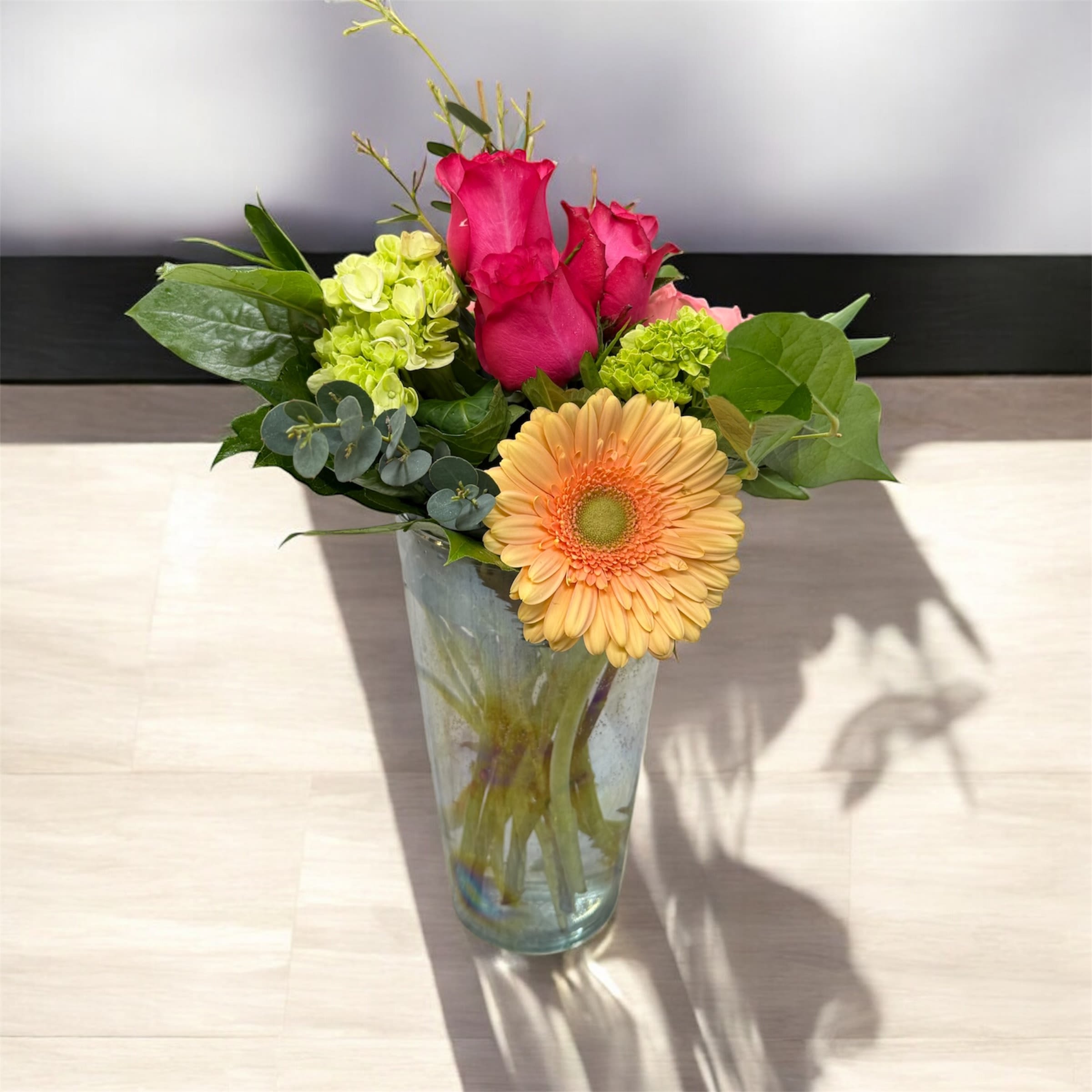 Modern Bloom - Our Modern Bloom Arrangement is a sleek and stylish display of fresh, seasonal flowers designed with a contemporary flair. Featuring clean lines, bold colors, and artistic balance, this arrangement brings a sophisticated touch to any space—perfect for modern homes, offices, or special occasions. 