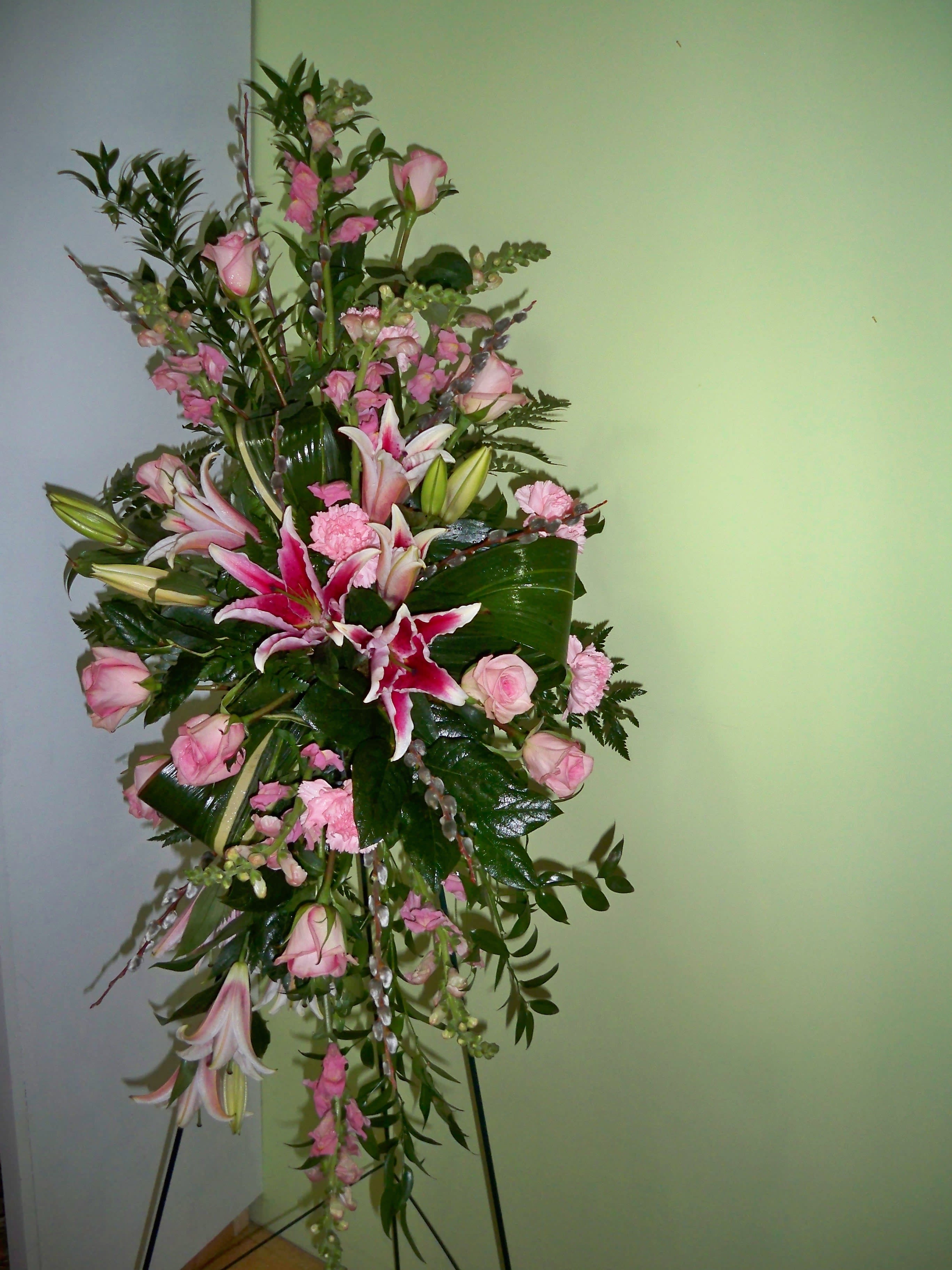 Pastel Perfection - A beautiful standing spray with an abundance of the season's finest blooms.