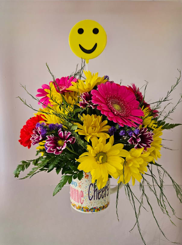 Cheers To You! Cheers To You! - Raise a glass... or a mug.. to celebrate someone! This cute cup celebrates someone special with bursting colors of pink, red, yellow and purple. Includes daisies, statice, carnations, and gerbera daisies.