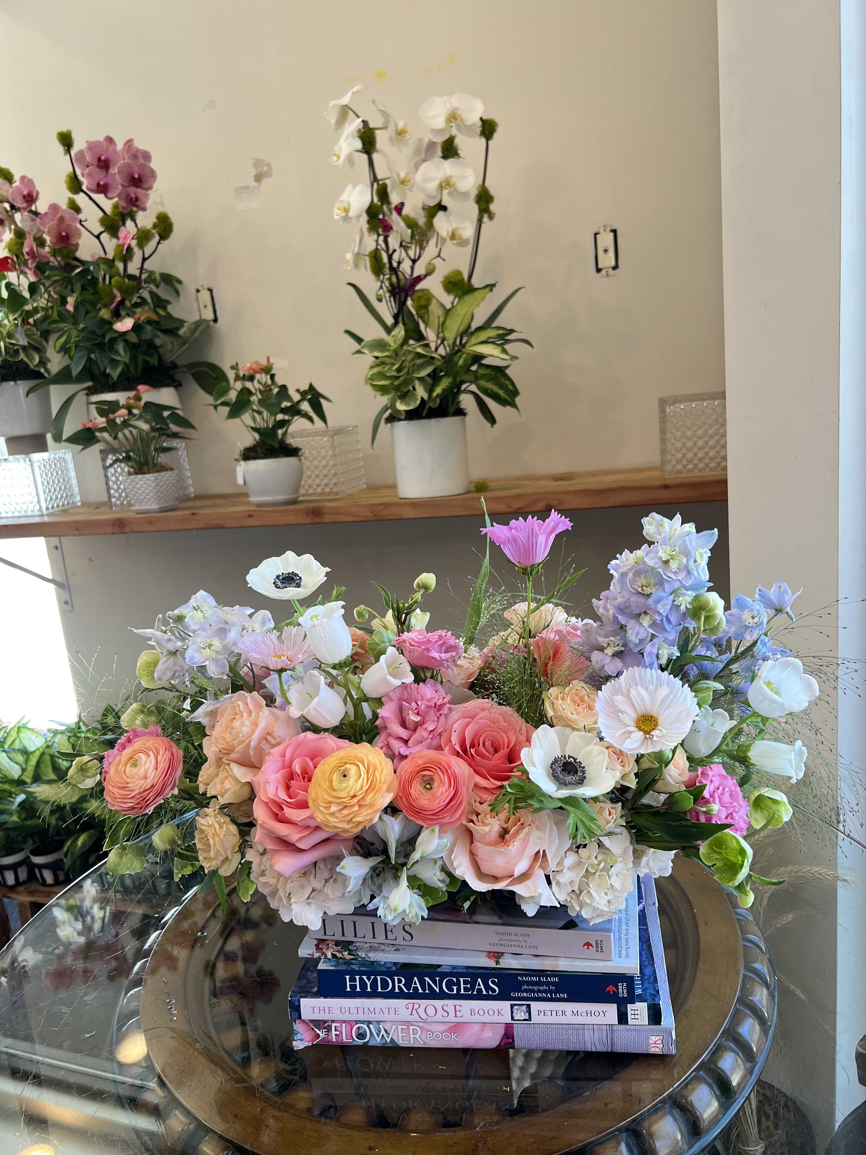 spring lush spring lush - Florals include: cosmos, light pink hydrangea, shimmer garden roses, saga roses, light blue delphinium, anemones, spray roses, hellebores, white canterbury bells, pink lisianthus, and ranunculus.
