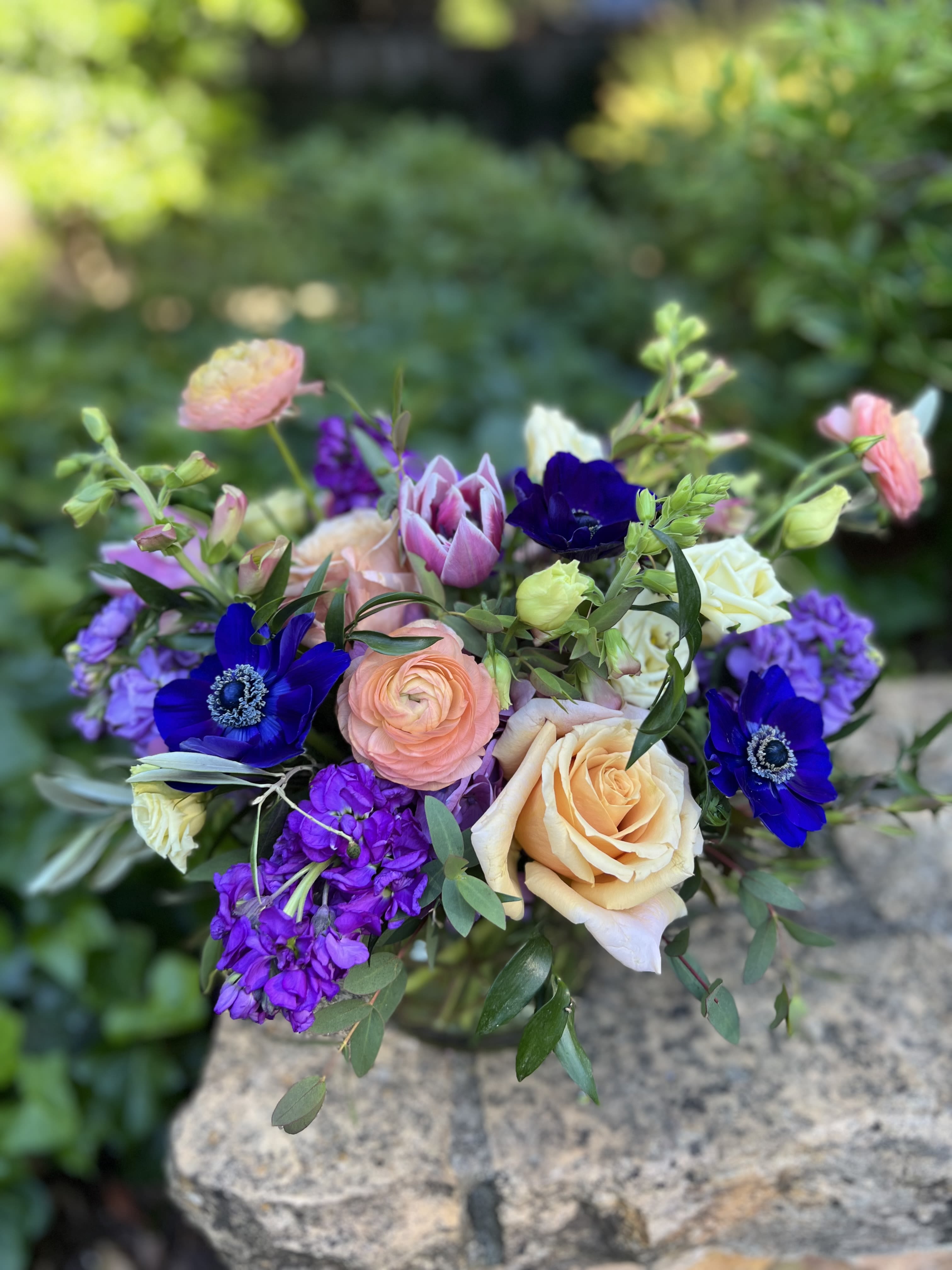 Berry Patch - Shades of purples and shocking anemone make up this eye catcher with touches of peach. 