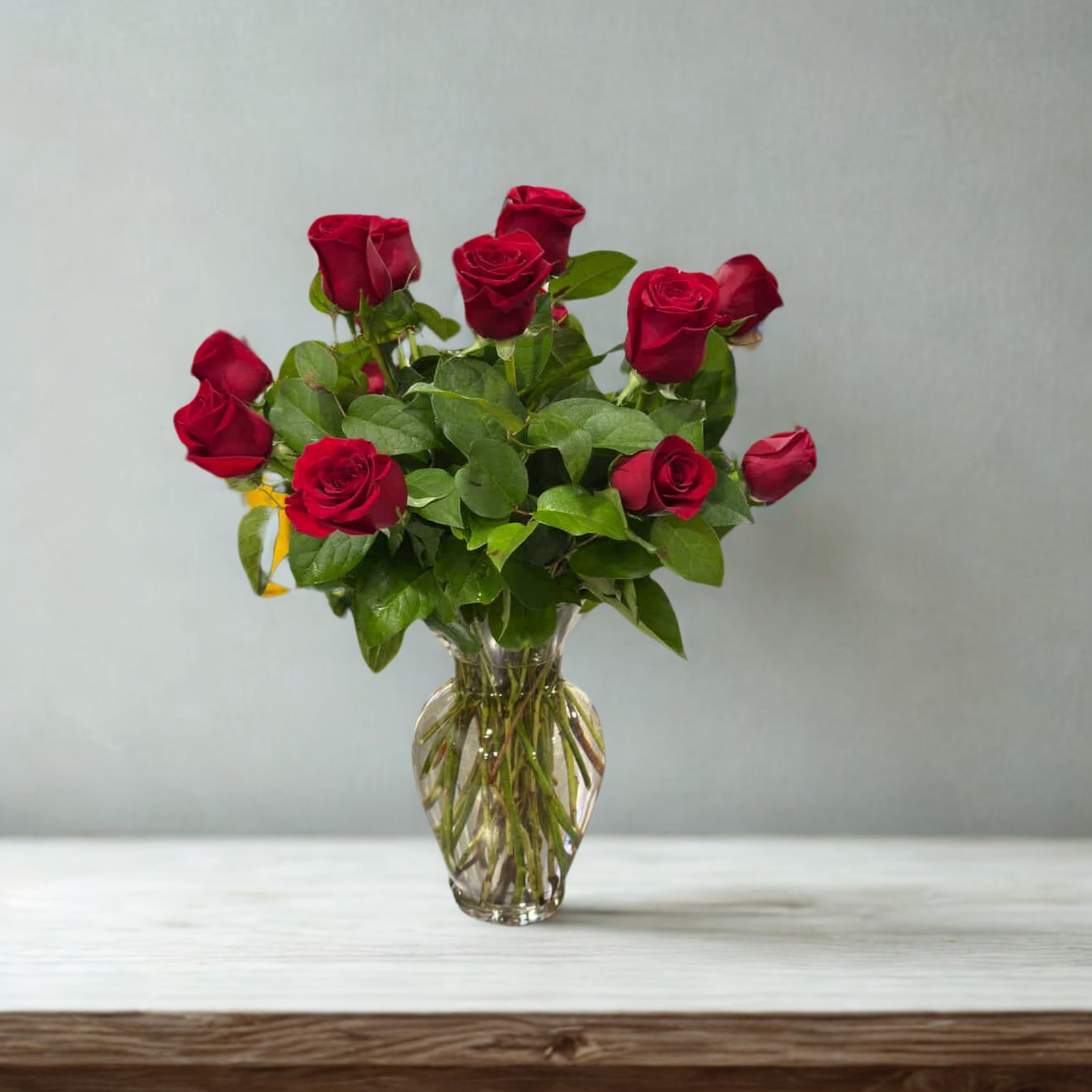 My True Love Bouquet with Long Stemmed Roses - Surprise her with a bouquet of a dozen long-stemmed red roses! Fresh and beautiful, arranged in an elegant glass vase with lush green foliage, they perfectly express your endless love. 