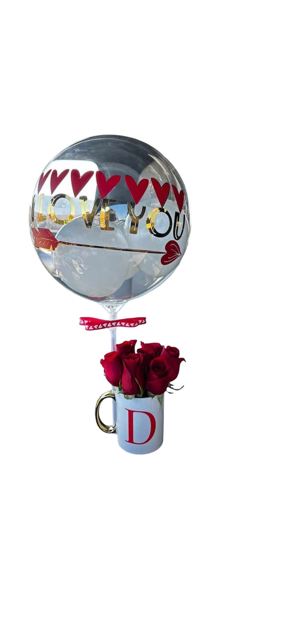 Golden Love Golden Love - An pesonalized arrangement with a clear ballon with "LOVE YOU" in gold vinyl, a white mug a gold handle and a letter, filled with red roses.