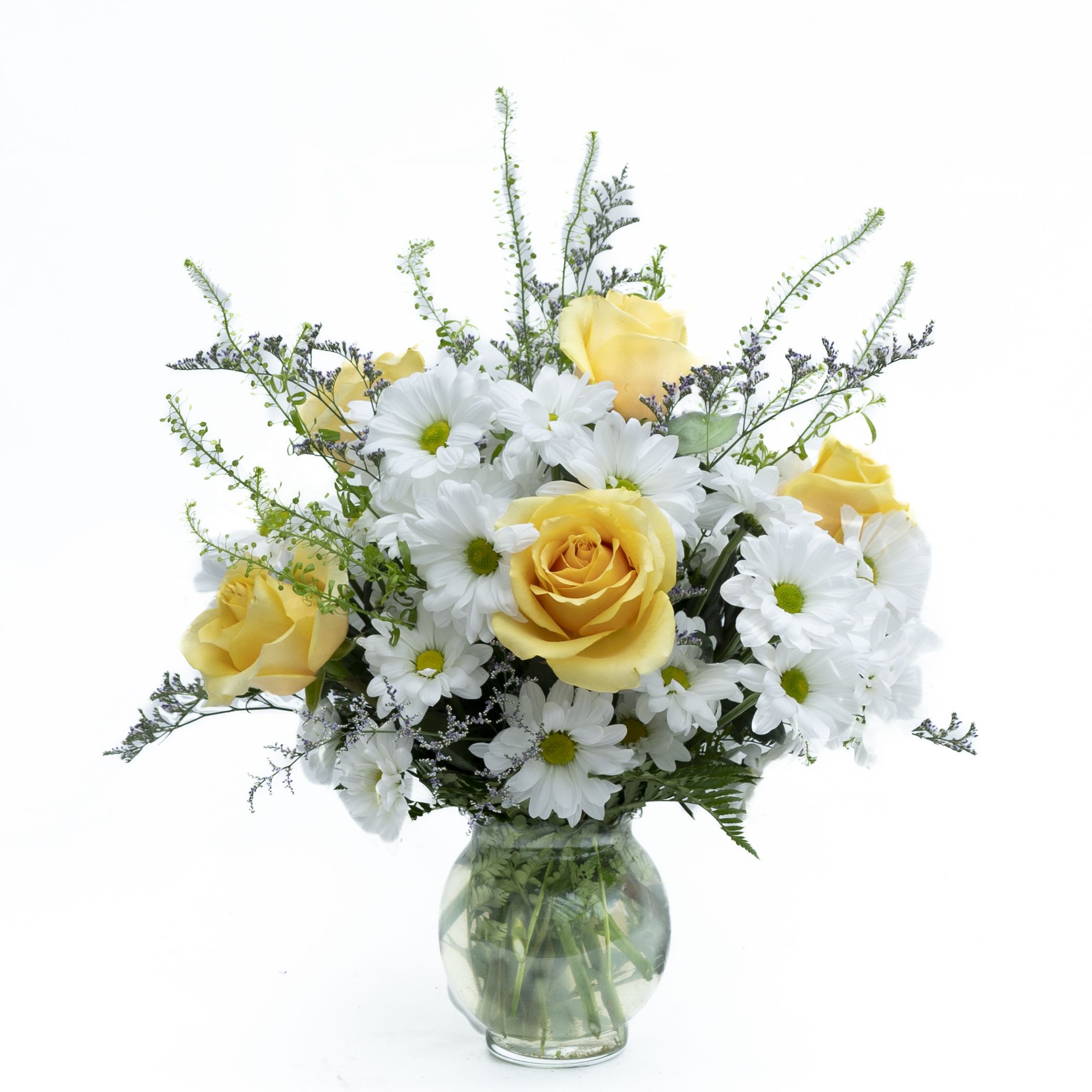 Sunshine Serenity Bowl - Brighten someone's day with our Sunshine Serenity Bowl, a delightful arrangement in a classic glass ivy bowl. This cheerful bouquet combines the purity of white daisies with the vibrant beauty of yellow roses, accented by the airy elegance of thlespia and the delicate charm of lavender limonium. Perfect for any occasion, this arrangement brings a touch of sunshine and serenity to any setting.