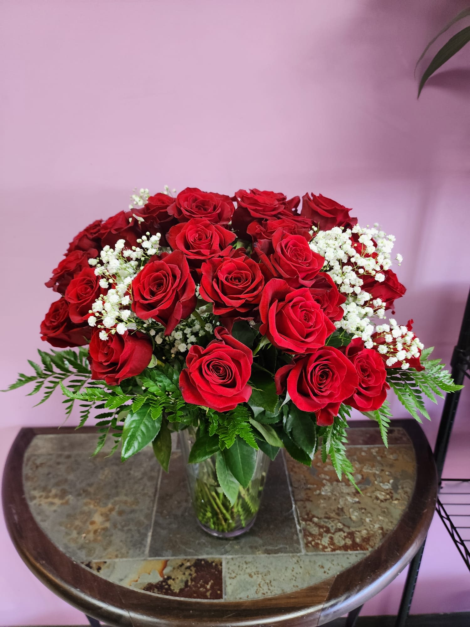 Fire Heart - This blazing floral arrangement will captivate any beating heart. Arrangement features 3 dozen red roses with baby breath and additional greenery. 