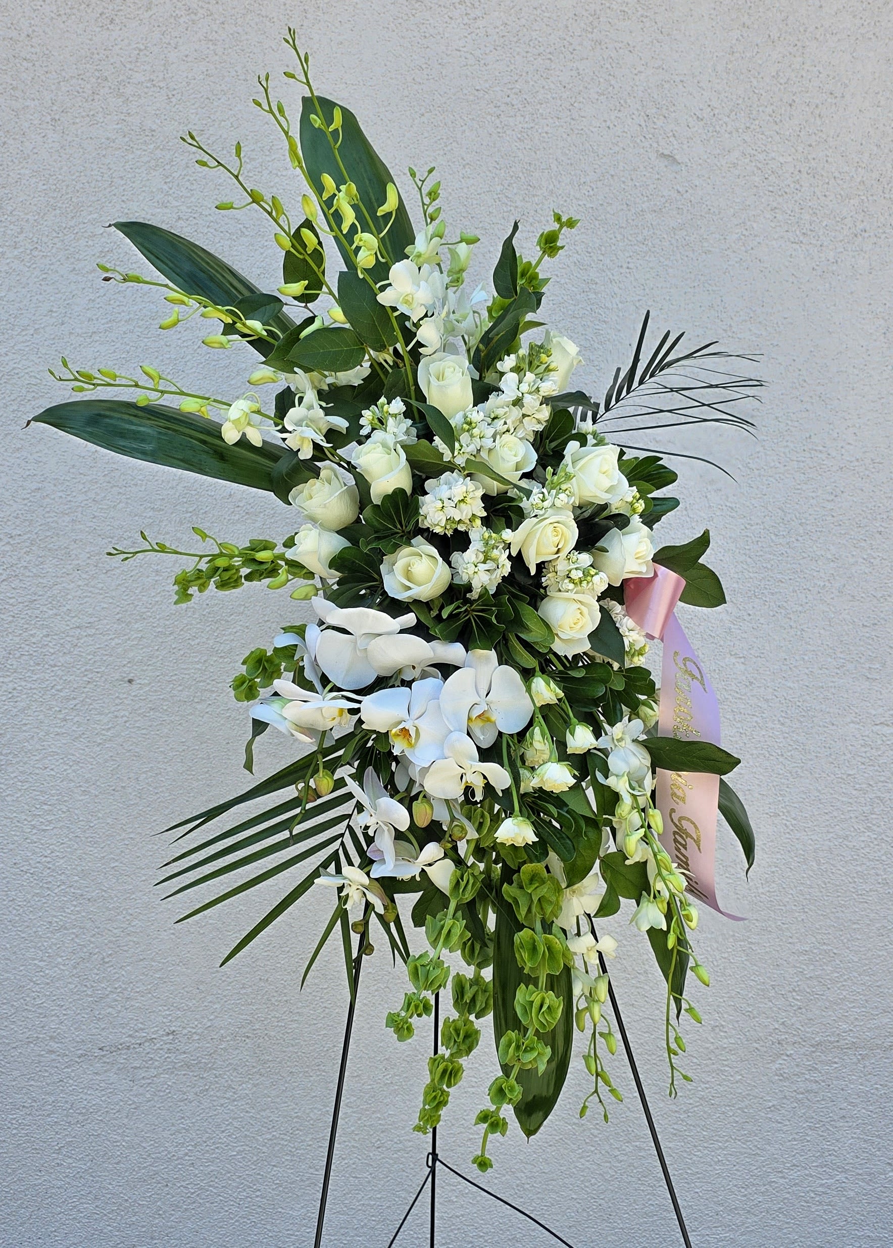 Asymmetrical Orchid White Standing Spray - A lovely asymmetrical White Standing Spray with Orchids and Mixed Flowers