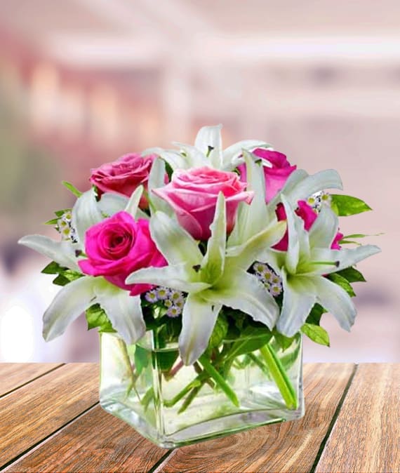 Graceful  Bouquet - Express your thoughts with grace and elegance through this Graceful Bouquet. Gaze as the lilies and roses continue to bloom for days to come! It's a beautiful arrangement that is suitable for a variety of occasions, whether it be a holiday, birthday, anniversary or new baby girl celebration.