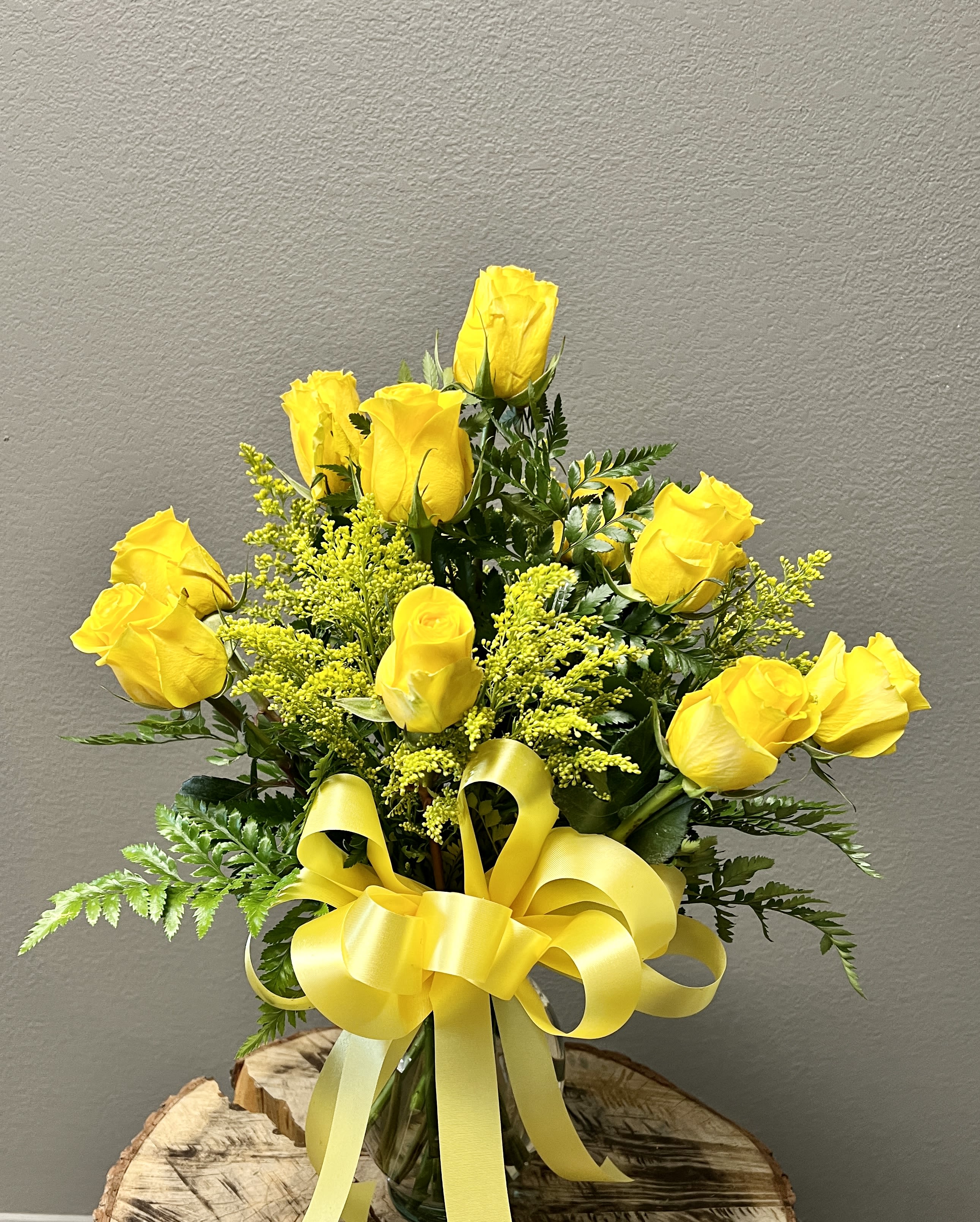 Yellow Rose of Texas - For your special someone who loves the yellow rose.  Arrangement is filled with greenery, yellow filler and a dozen yellow roses.  