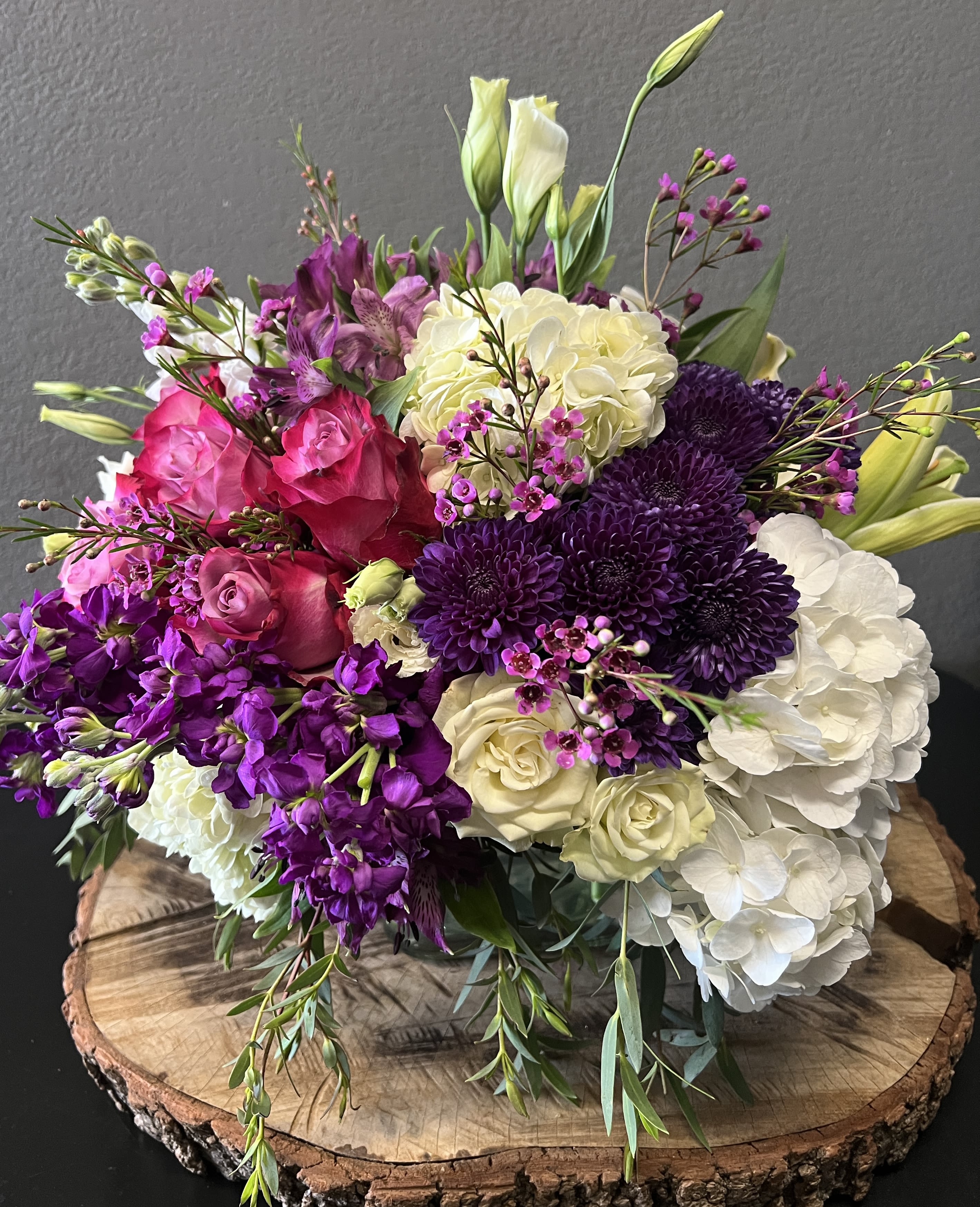 Purple Passion - A low luxurious vase arrangement for those that love the color purple and pops of white. Can be sent for any occasion!