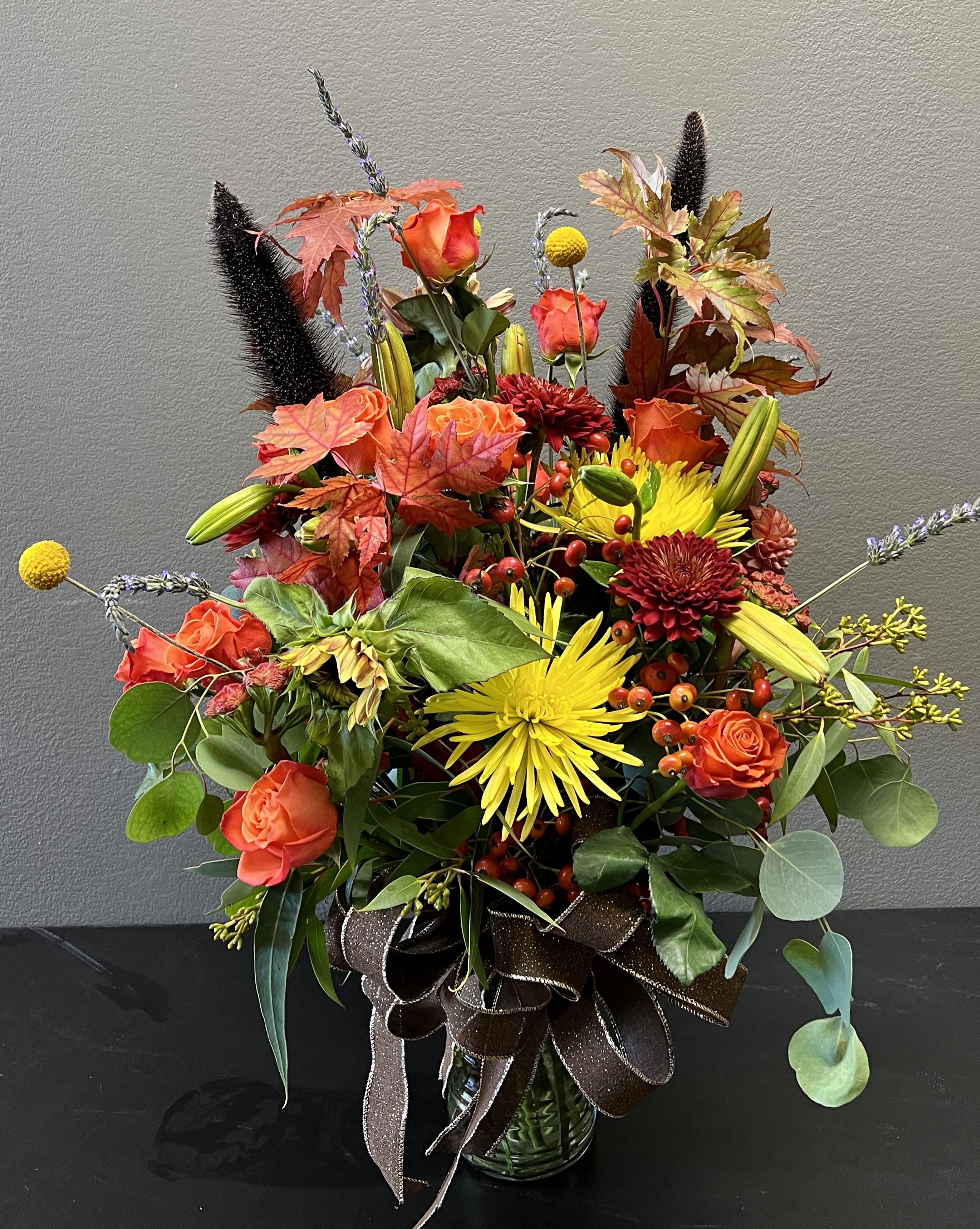 Happy Fall Y’all - A beautiful arrangement using fall colors and greenery for those that love the colors of fall.  