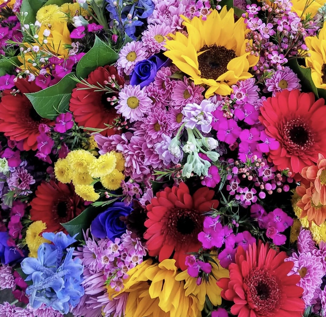 Madness Monday! - Start off their week with a cheerful designer's choice floral arrangement.  Tell us the occasion and we will pick the best flowers &amp; vase. Size, small to medium.  Please note, this special offer is valid Only on Mondays 
