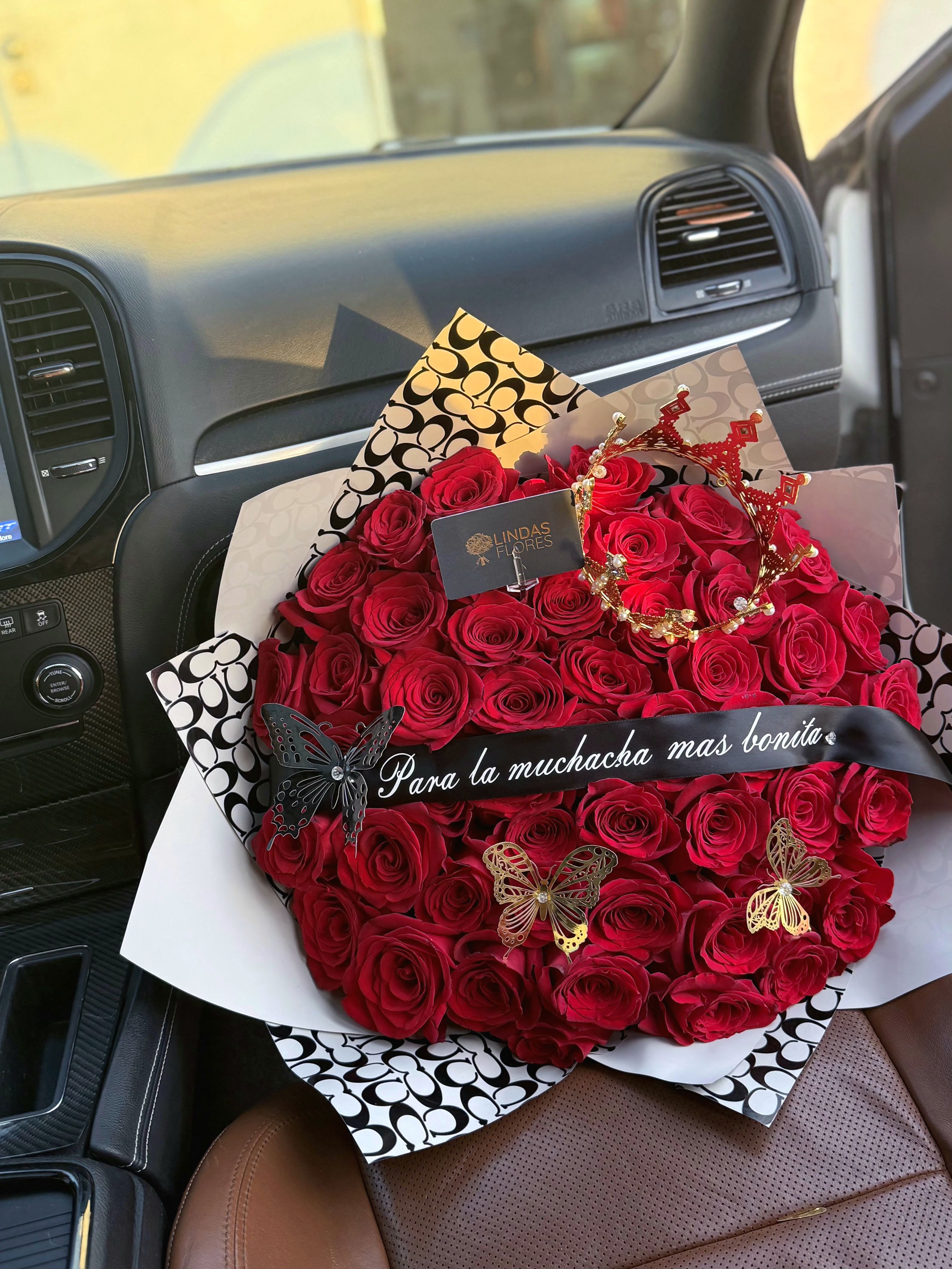 50 ct Long Stem Red Rose Bouquet - Experience the timeless elegance of romance with our exquisite red rose bouquet, symbolizing love and passion. Each rose, meticulously selected for its vibrant hue and velvety petals, exudes a captivating fragrance that transforms any journey into a memorable experience. The bouquet is designed to evoke feelings of affection and admiration, making it the perfect gift for anniversaries, special occasions, or simply to express heartfelt emotions. Whether you are surprising a loved one this stunning rose bouquet will surely captivate the one you love.